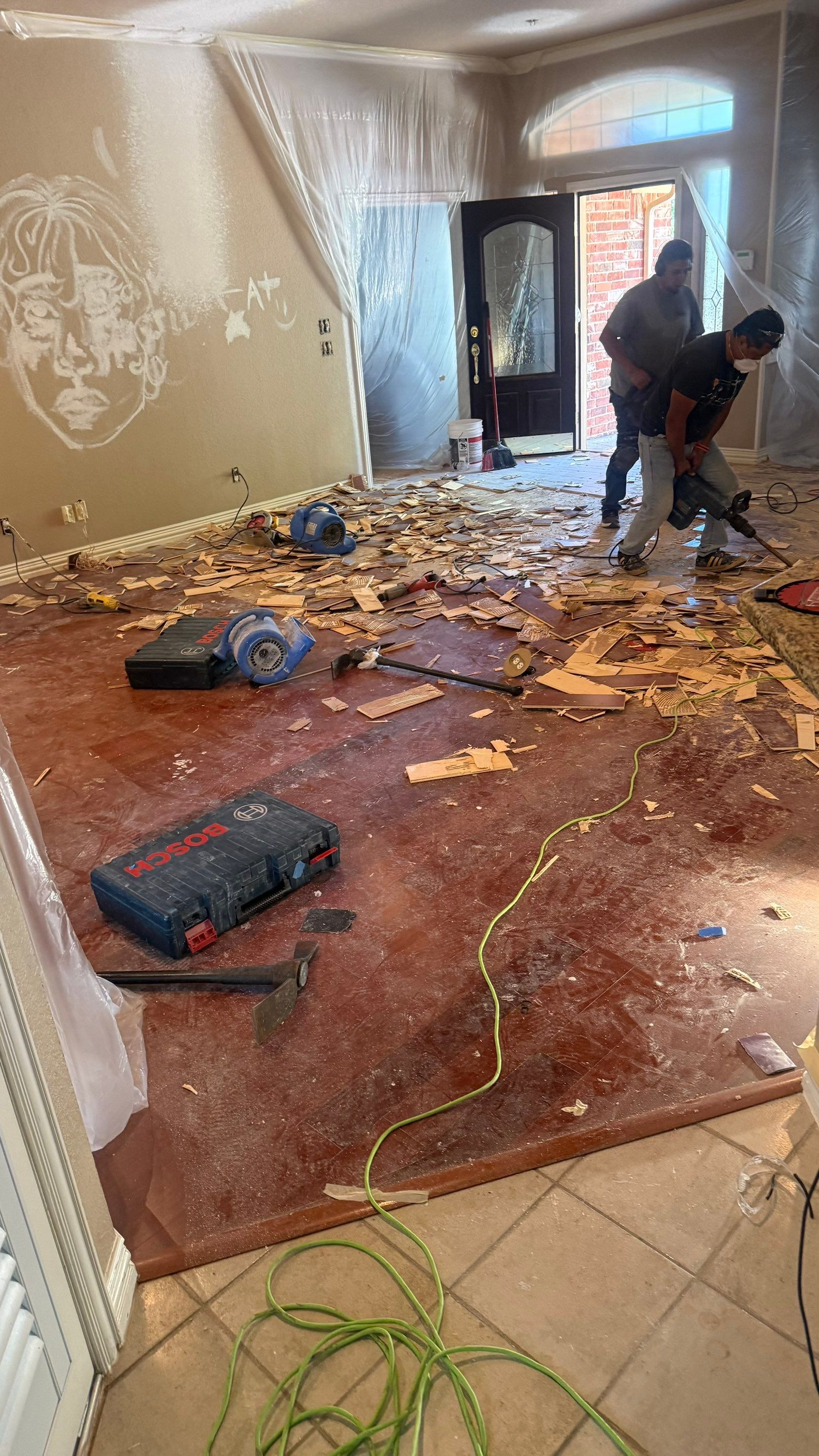 Interior Renovation with Dark Wood Floors and Geometric Fireplace Tile by Simmons Floors