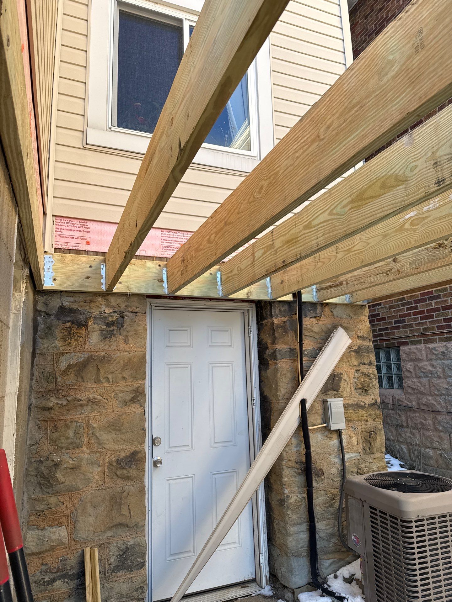 Deck and door by Cousins Roofing Siding & Decks