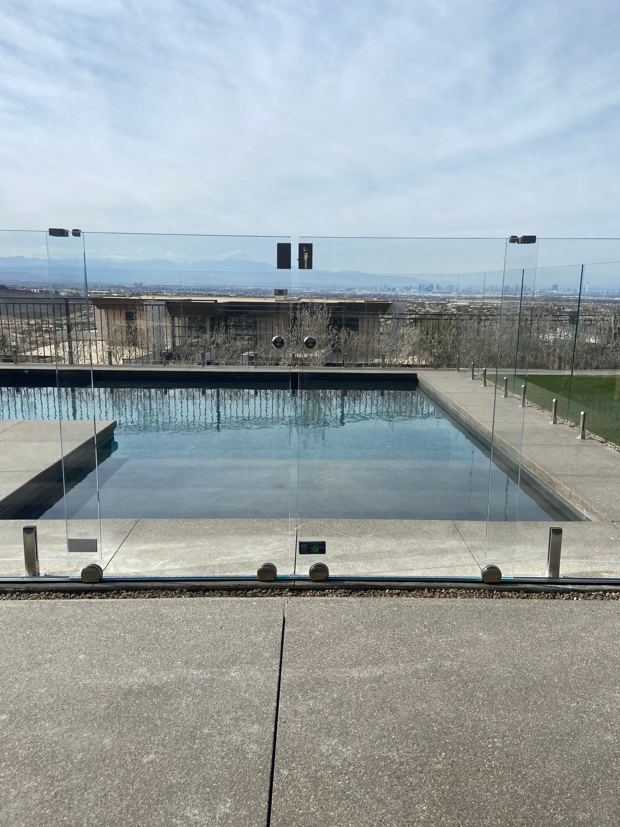 Exterior wood refinish & glass pool enclosure by Level Builders