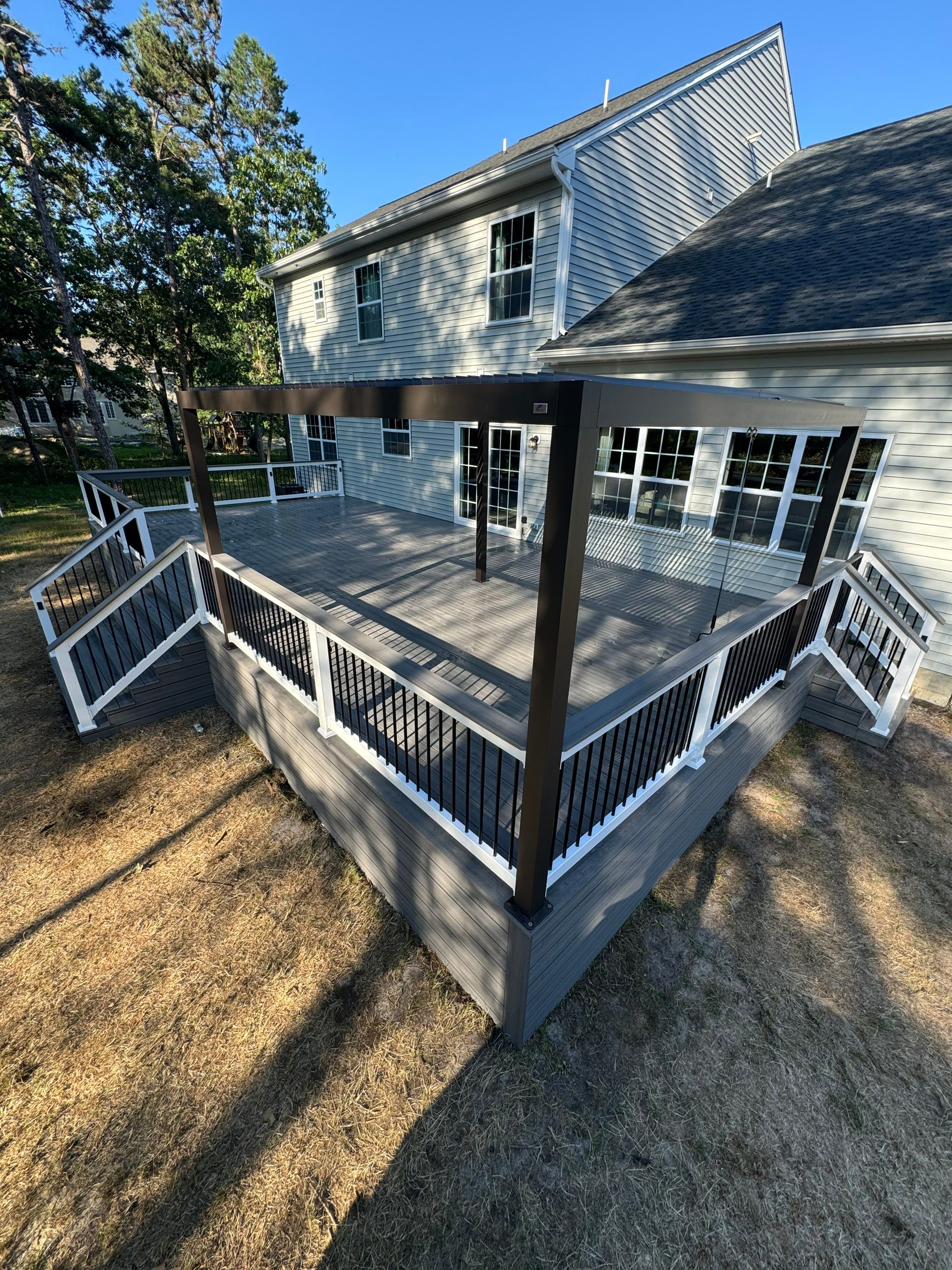 New Deck with Manual Louvered Pergola by deck guardian
