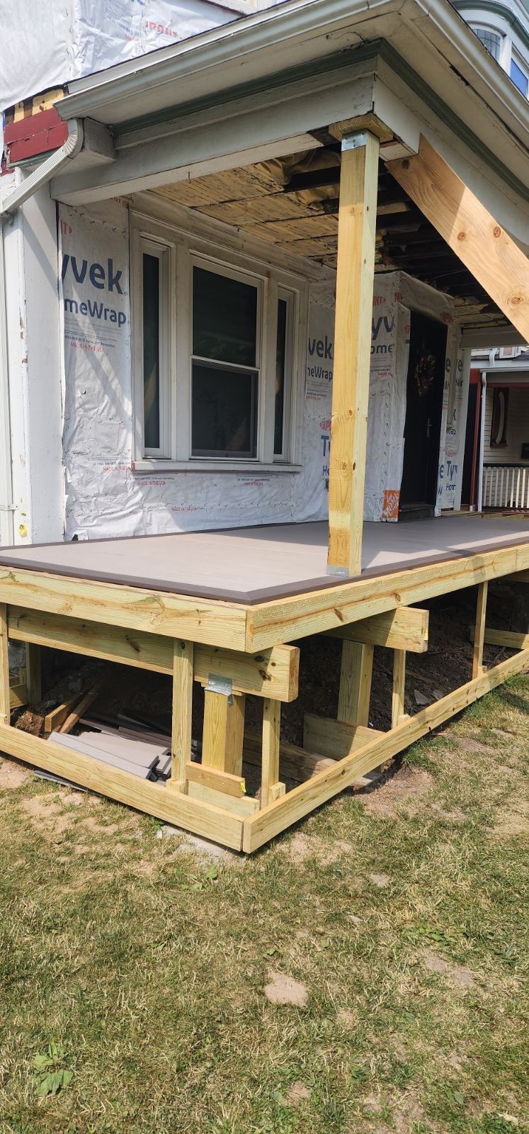 Exterior Renovations- Siding, Stamped Concrete, Porch, and Railings by Ivy Lea Construction