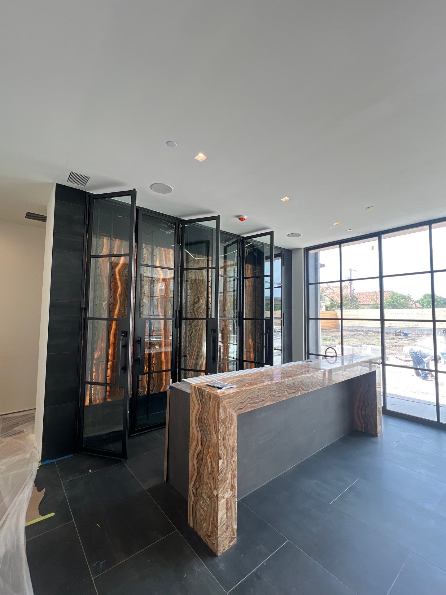 Custom Black-Framed Glass Wine Cellar Installation in Dallas by Solara Custom Living