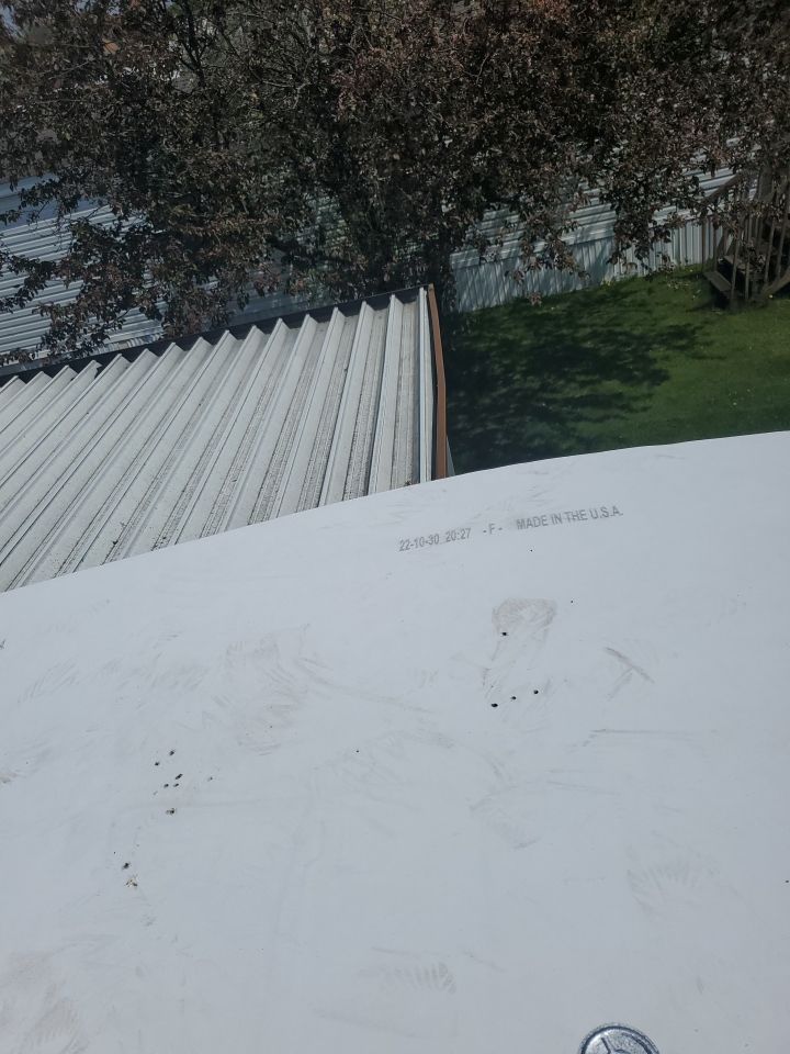 Residential Roofing Installation using 60 mil rubber roof  by Nitro Roofing and Construction