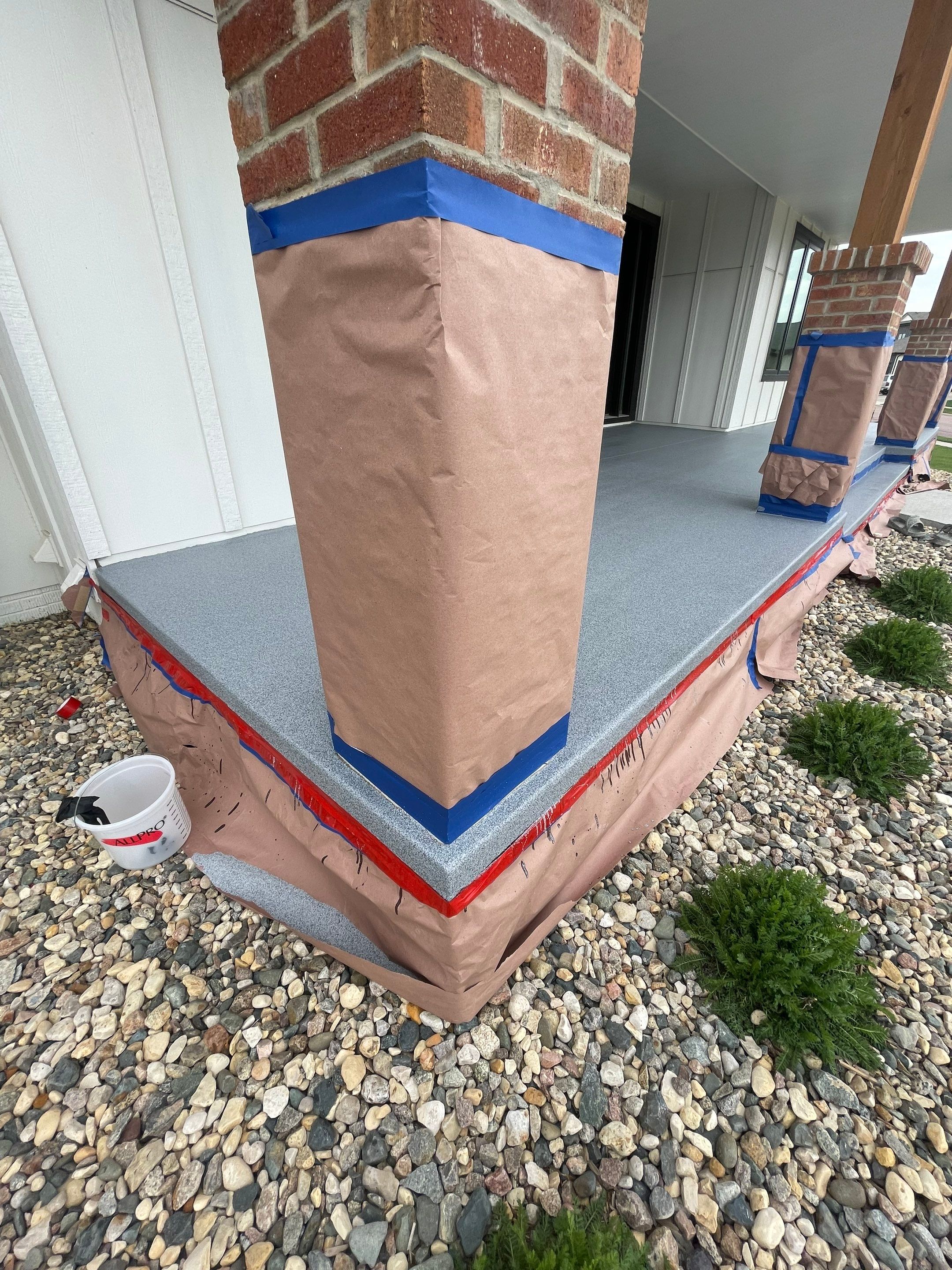 Grey Speckled Concrete Porch Coating for Sioux Falls Home by Select Painting, Coatings & Garage Cabinets