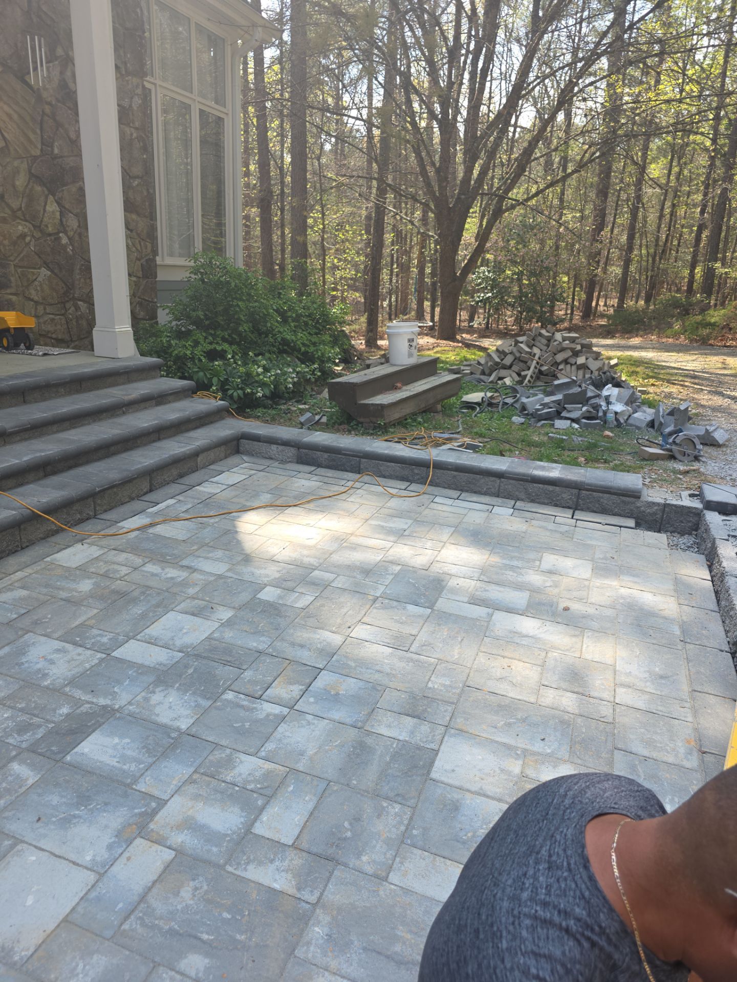 Pittsboro Outdoor Living Transformation – Retaining Wall, Paver Patio & Elevated Deck by Elite Remodeling and Design LLC