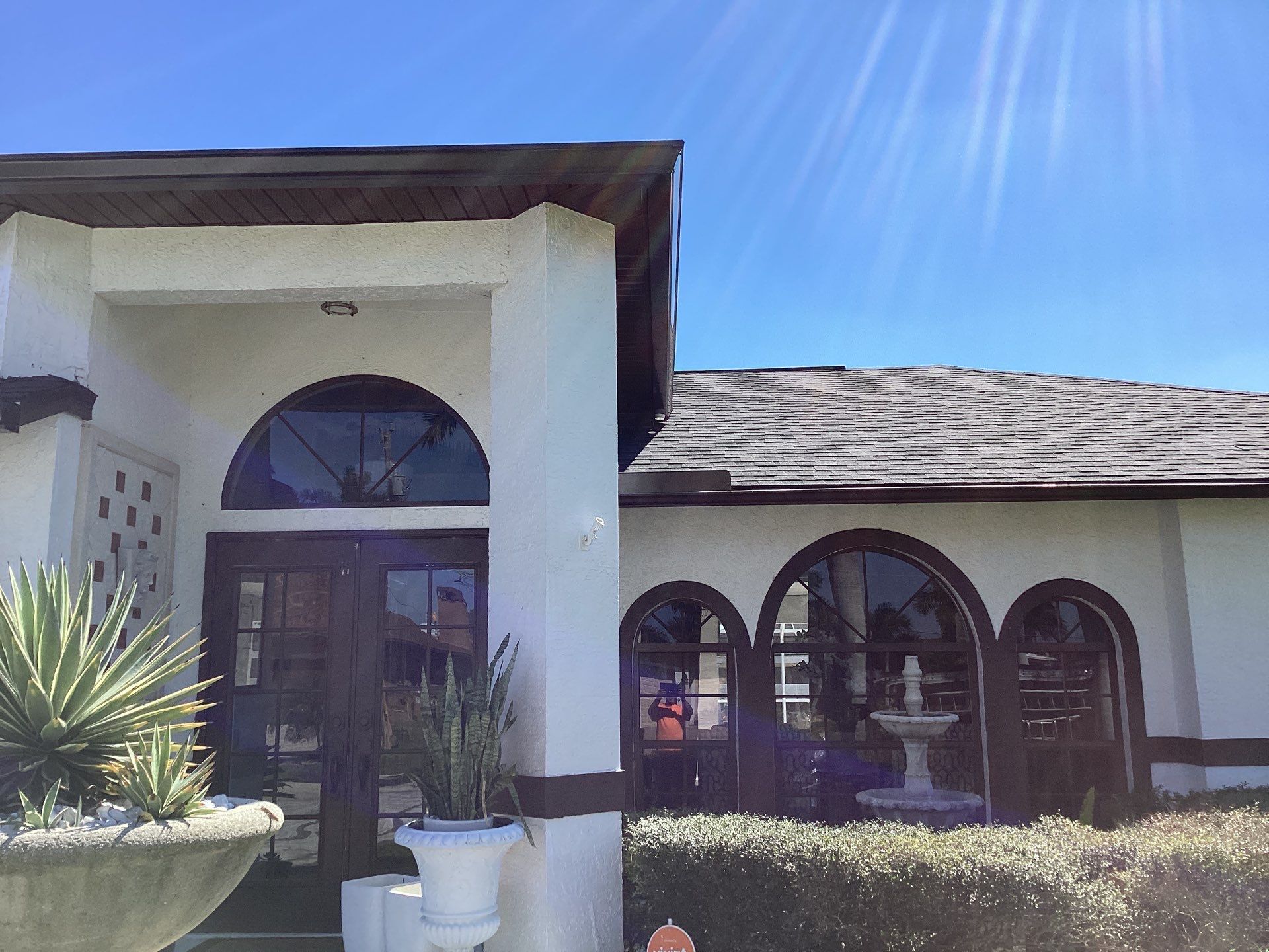 Brown Gutter + White and Brown Downspouts in Cape Coral FL by Gutter Professors