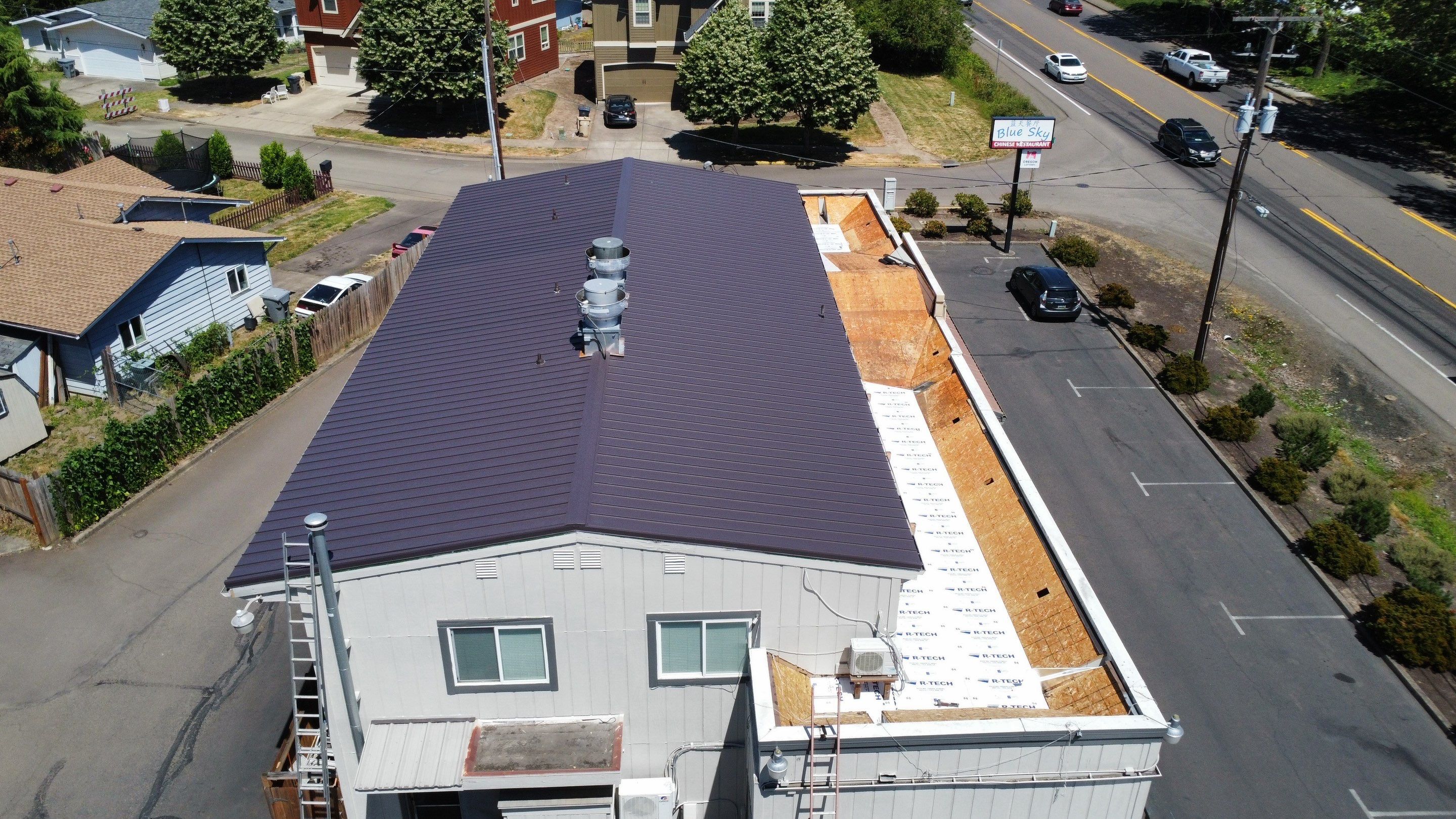 Commercial Flat Roof Installation using Bruce and Dana Snap Lock Metal (Color: Brown) by Orezona Building & Roofing Company, Inc.