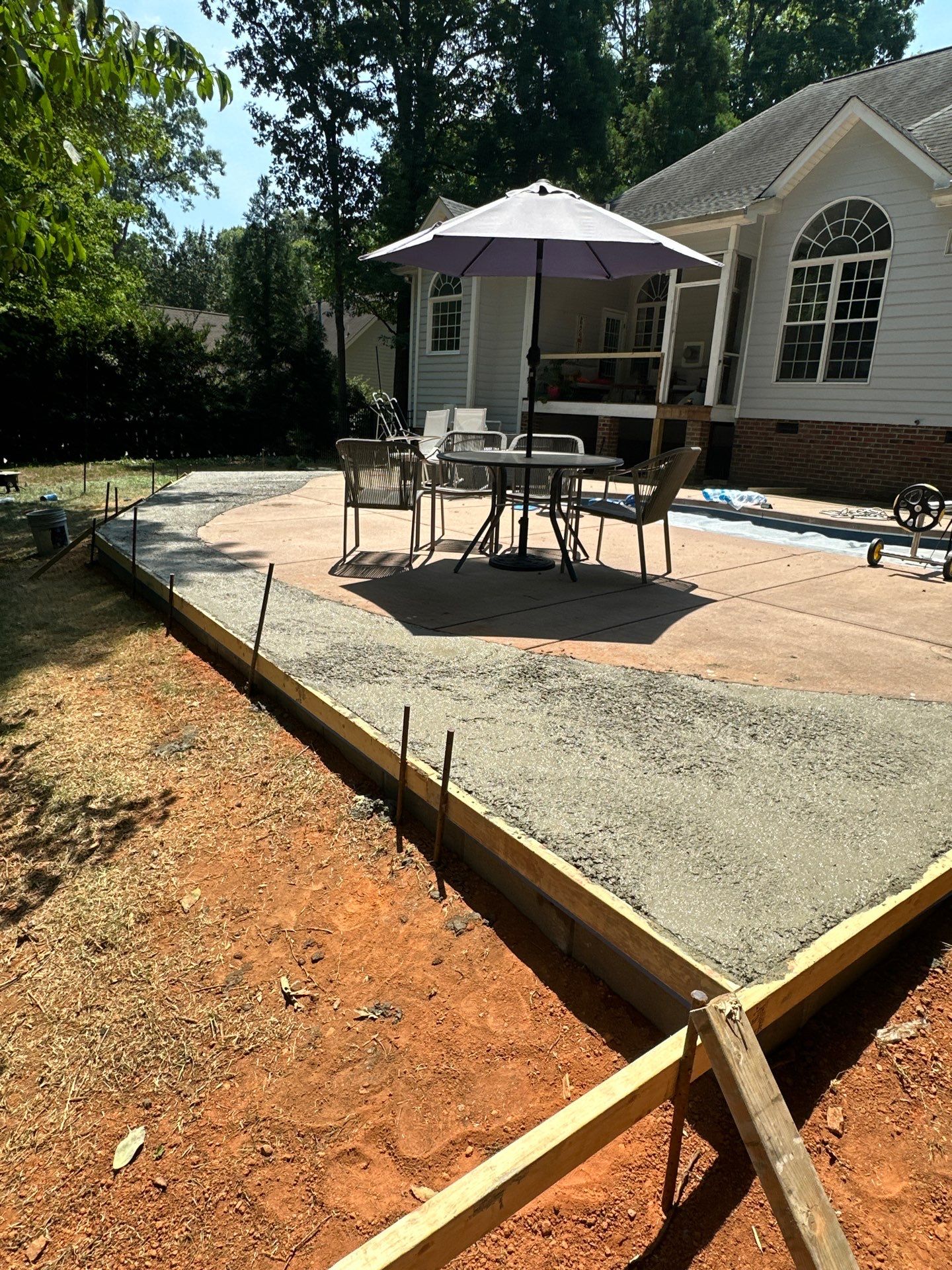 Cool decking pool in Youngsville by Martinez Brother’s Nc Landscaping Inc