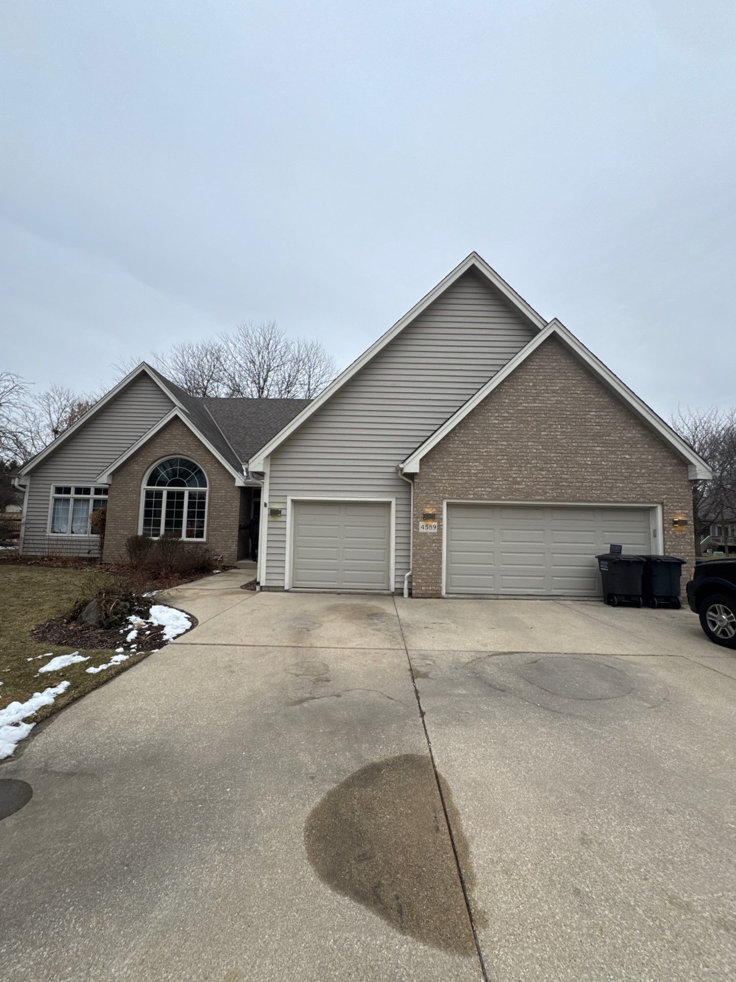 Exterior Home Staining Project in Greenfield Using Sherwin-Williams Amazing Gray by OCS Contracting Services