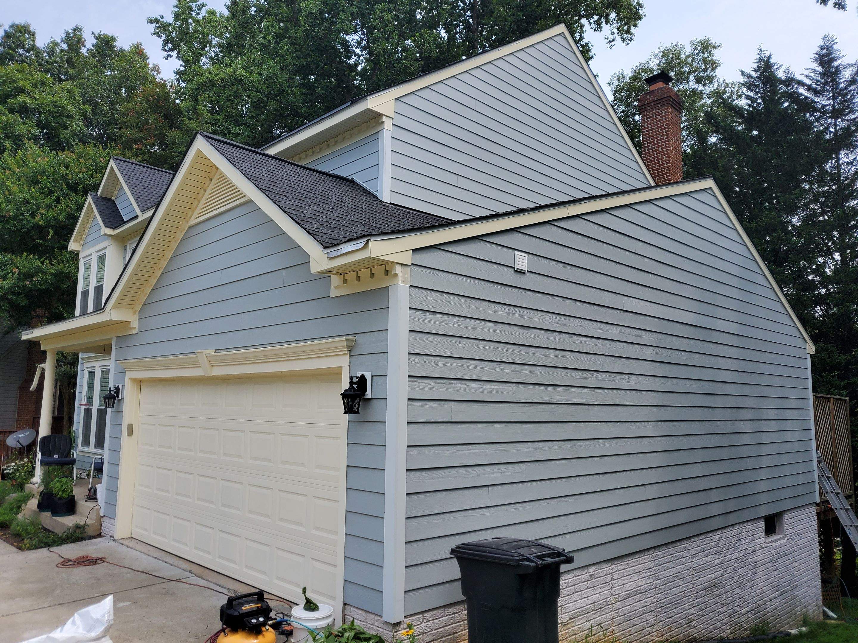 Exterior Home Makeover using GAF Timberline HDZ, GAF Decotech, and James Hardie Siding by American Home Contractors