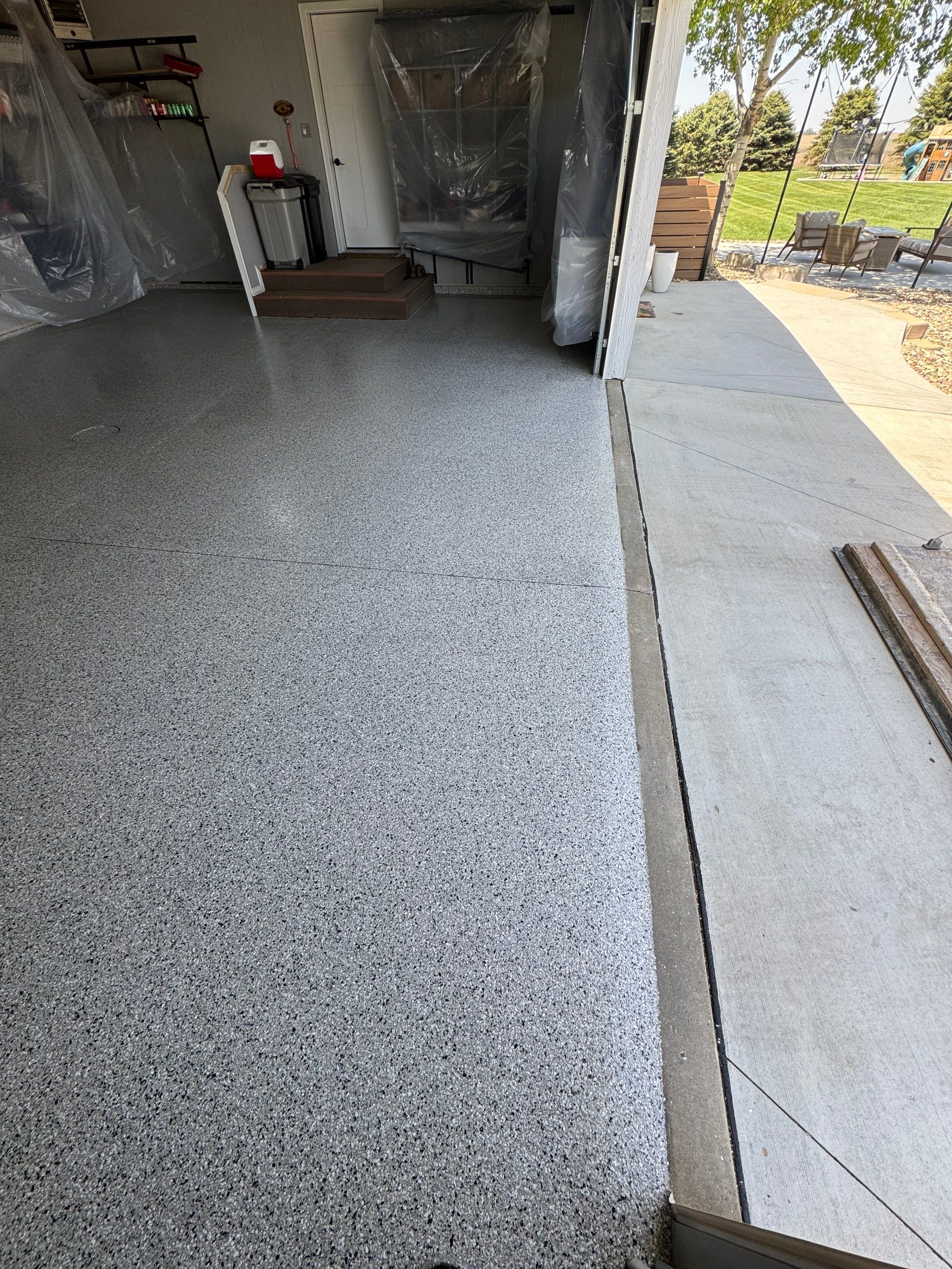 High-Gloss Grey Epoxy Floor Coating for Inwood Garage by Select Painting, Coatings & Garage Cabinets