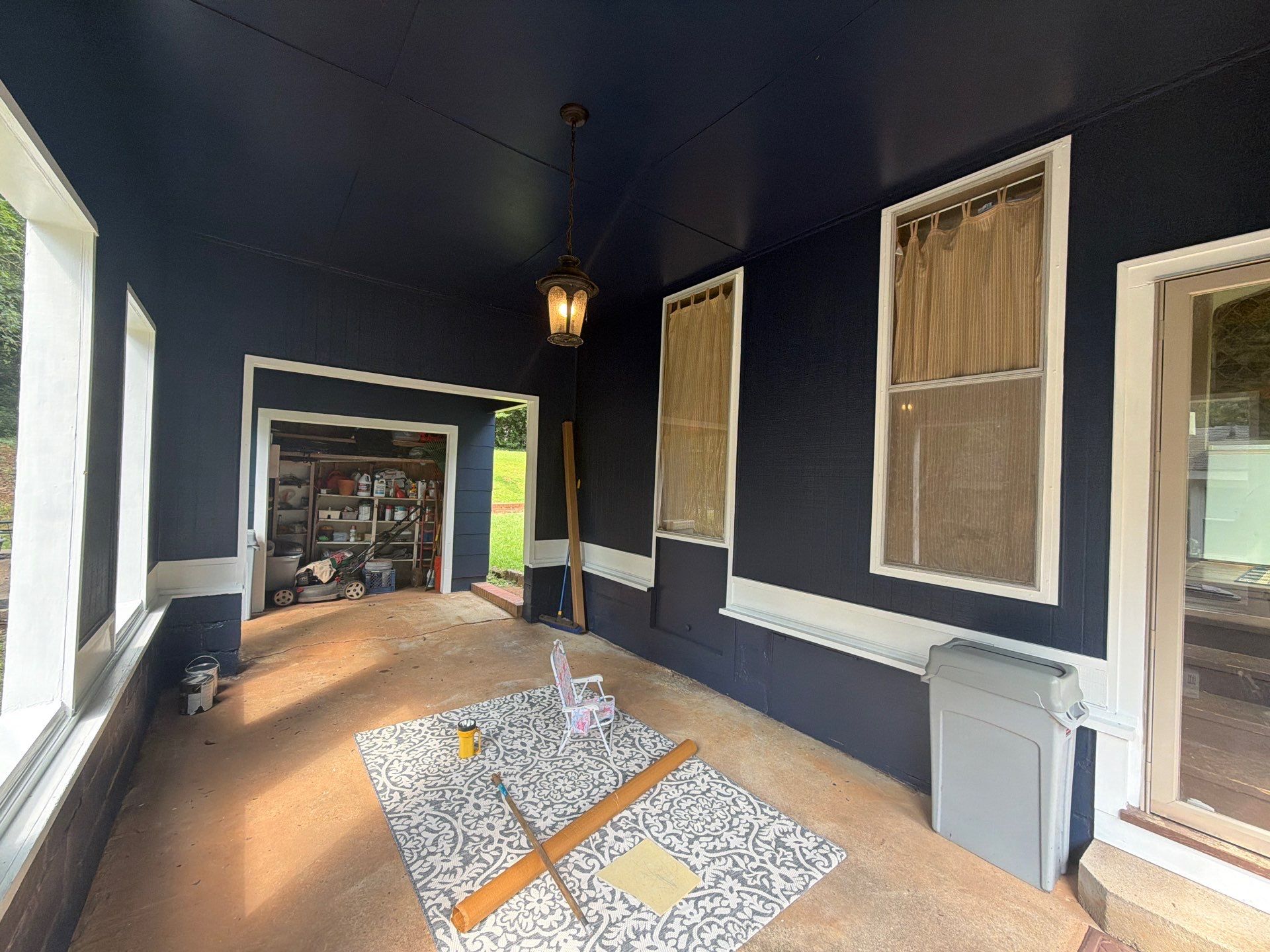 Full Exterior Repaint with Navy Blue and White Trim by Swift Home Renovations