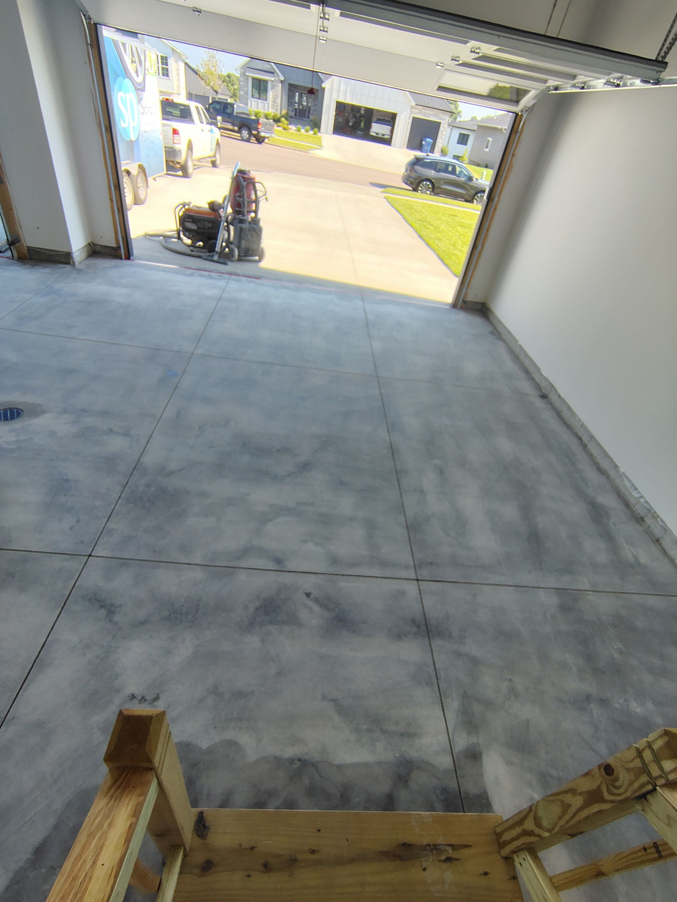 Cabin Fever Decorative Flake Garage Floor Coating in Sioux Falls by Select Painting, Coatings & Garage Cabinets