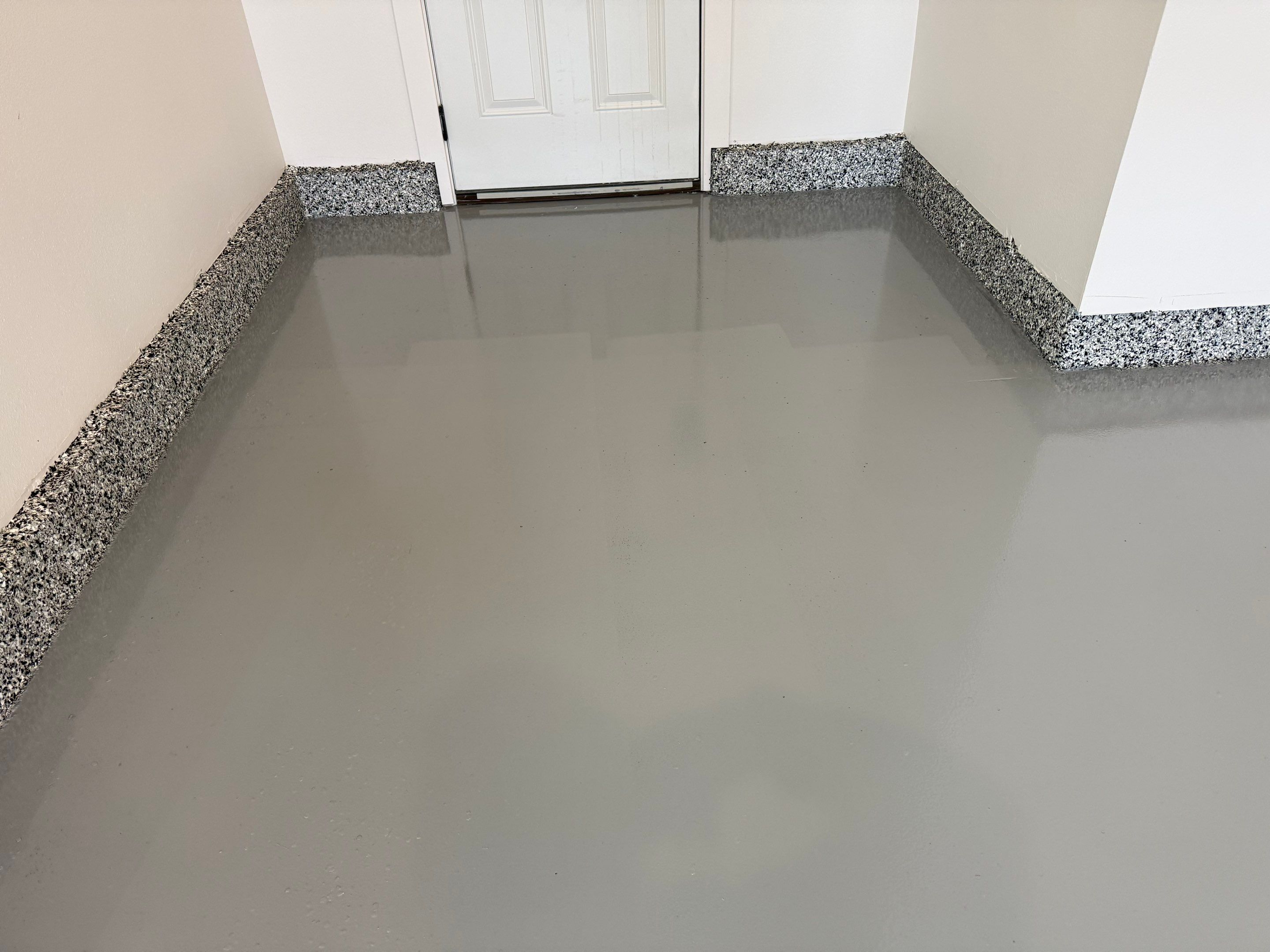 Multi-Car Garage Epoxy Floor Coating and Concrete Finishing in Sioux Falls by Select Painting, Coatings & Garage Cabinets