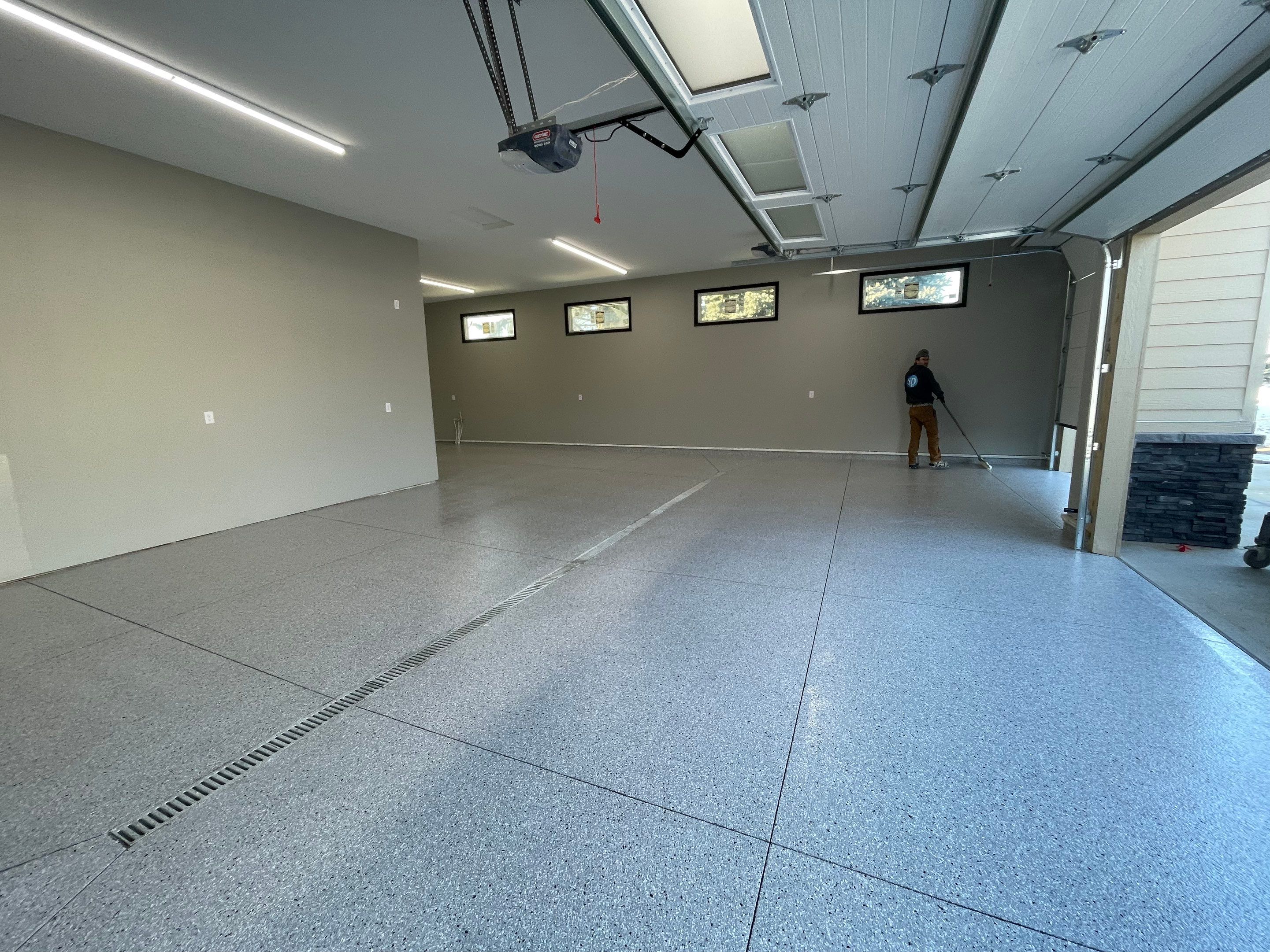 Decorative Flake Concrete Coating Installation in North Sioux City by Select Painting, Coatings & Garage Cabinets