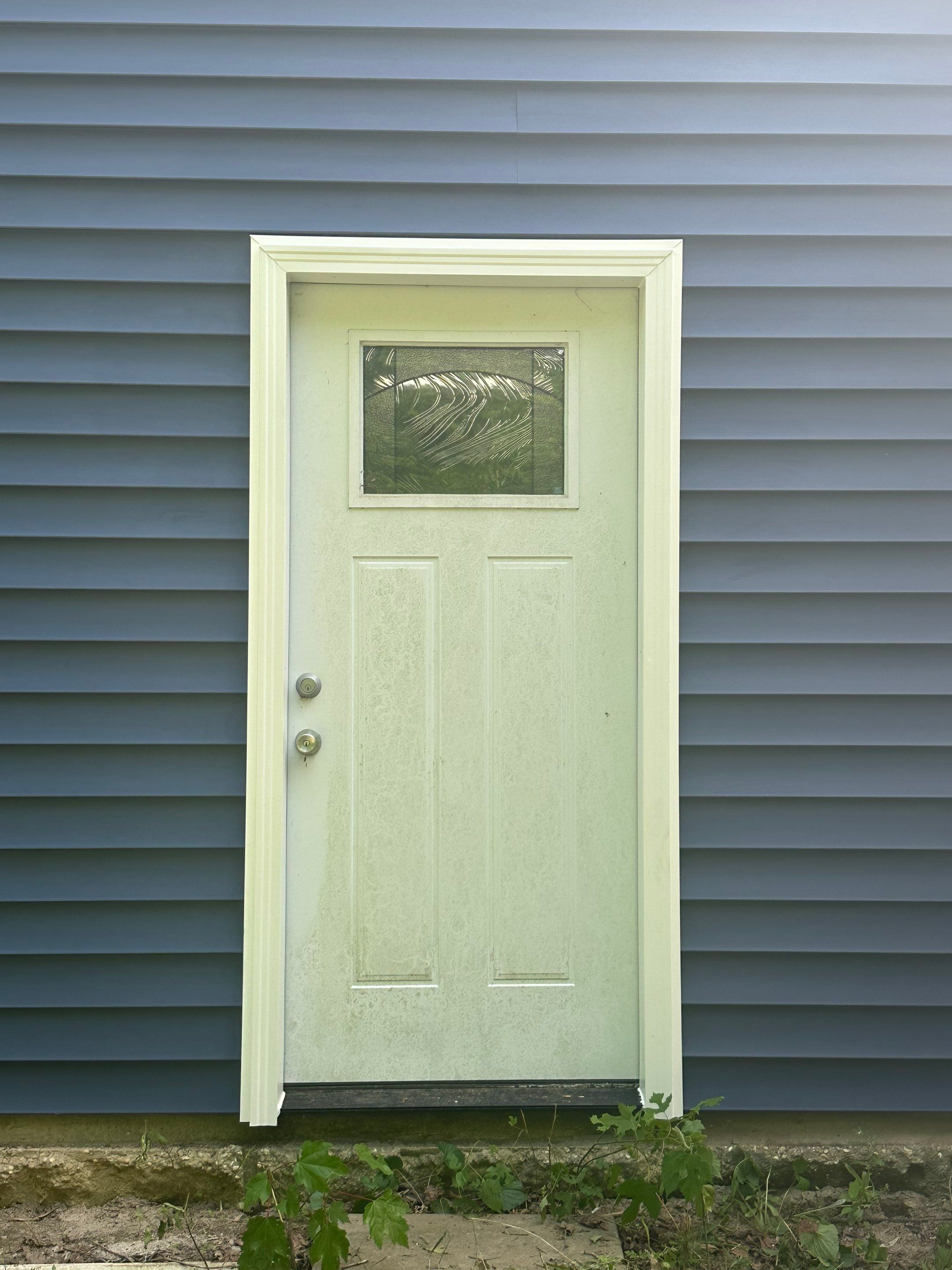 Gloucester Exterior Overhaul with Navy Blue Siding and New Roof by Cade Construction