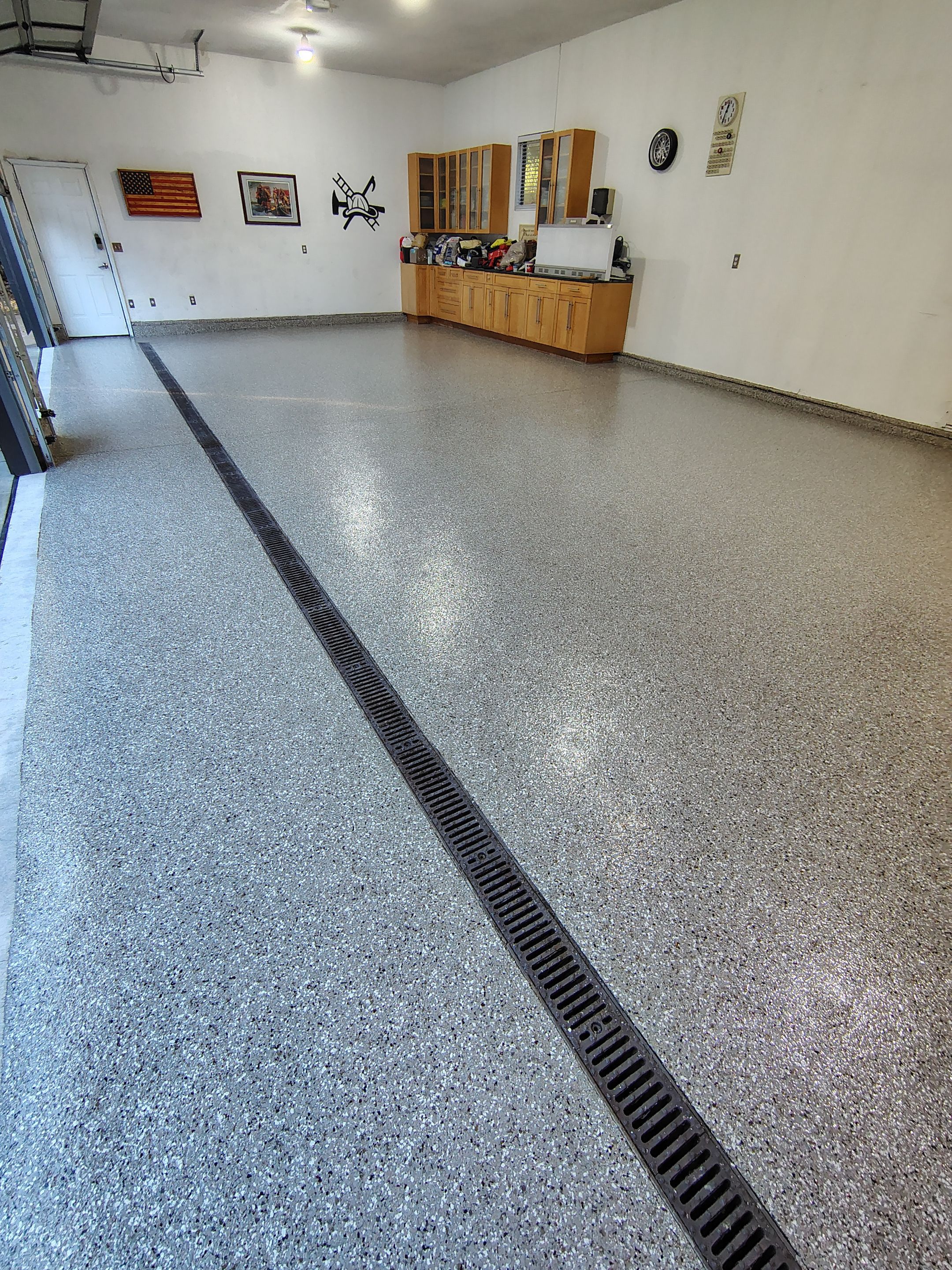Garage Floor and Entry Step Concrete Coating in Sioux Falls by Select Painting, Coatings & Garage Cabinets