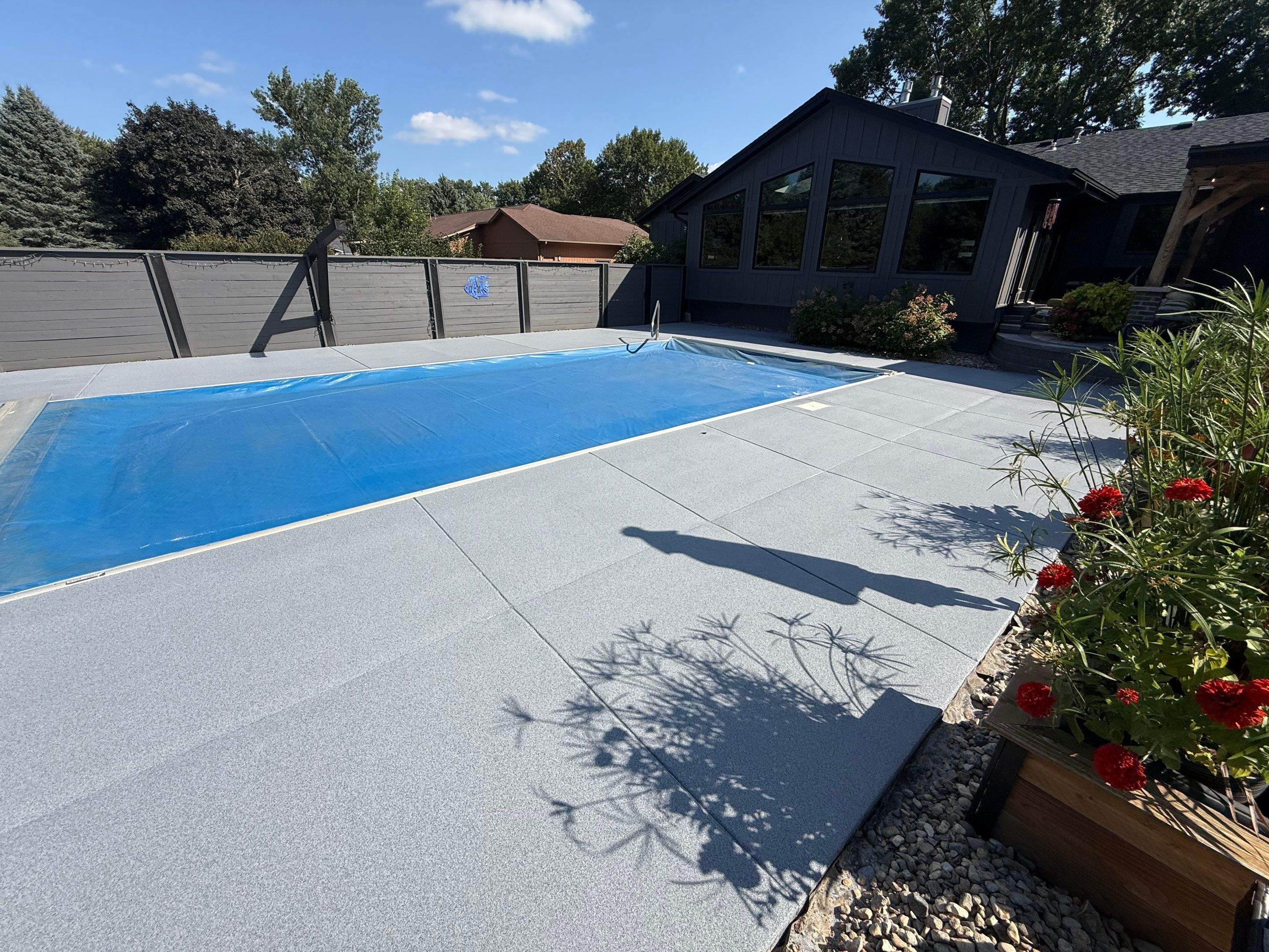 Garage Floor and Textured Pool Deck Coating in Sioux Falls by Select Painting, Coatings & Garage Cabinets