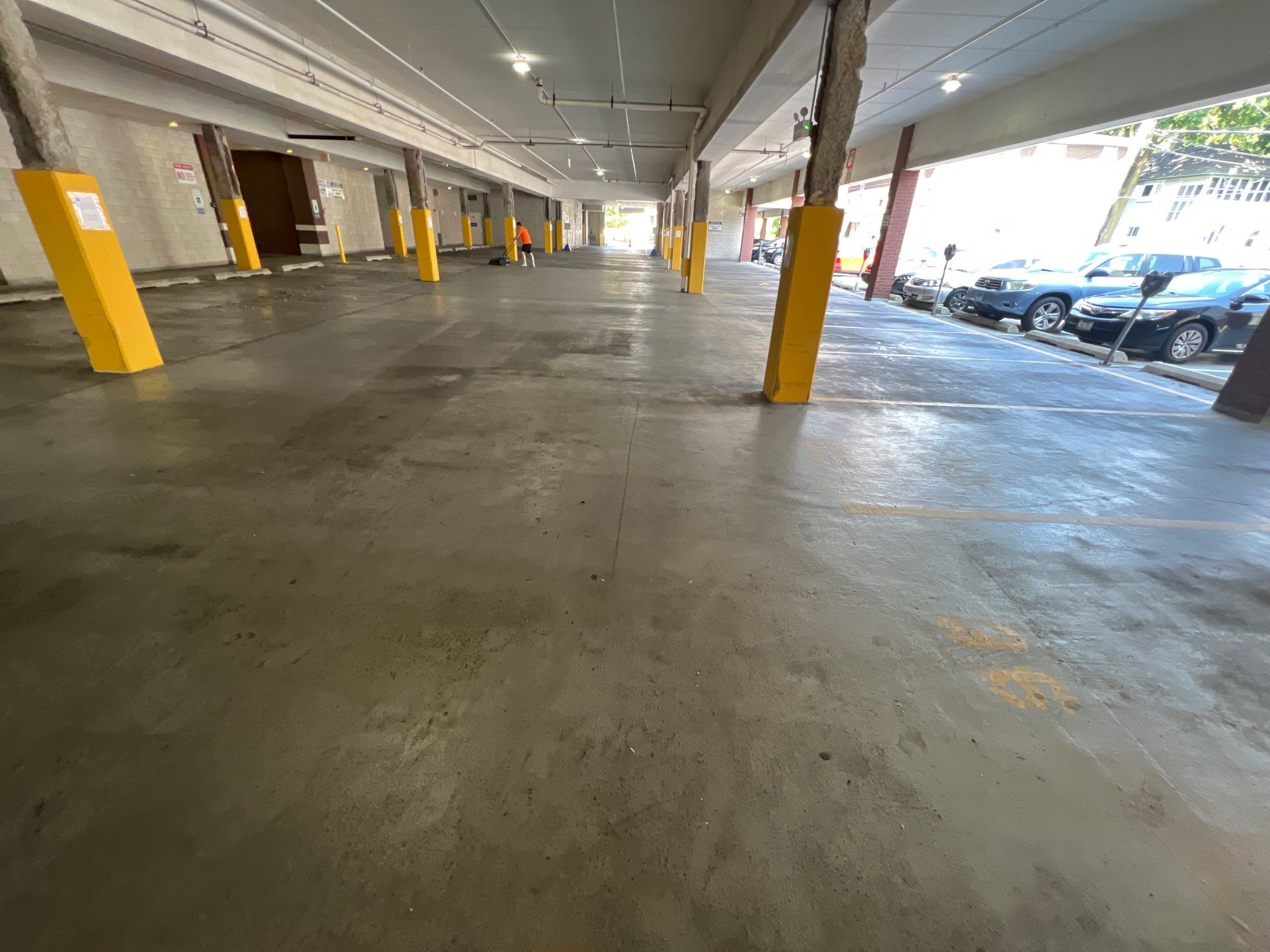 Parking garage using Hot water by Northern Power Washing LLC.