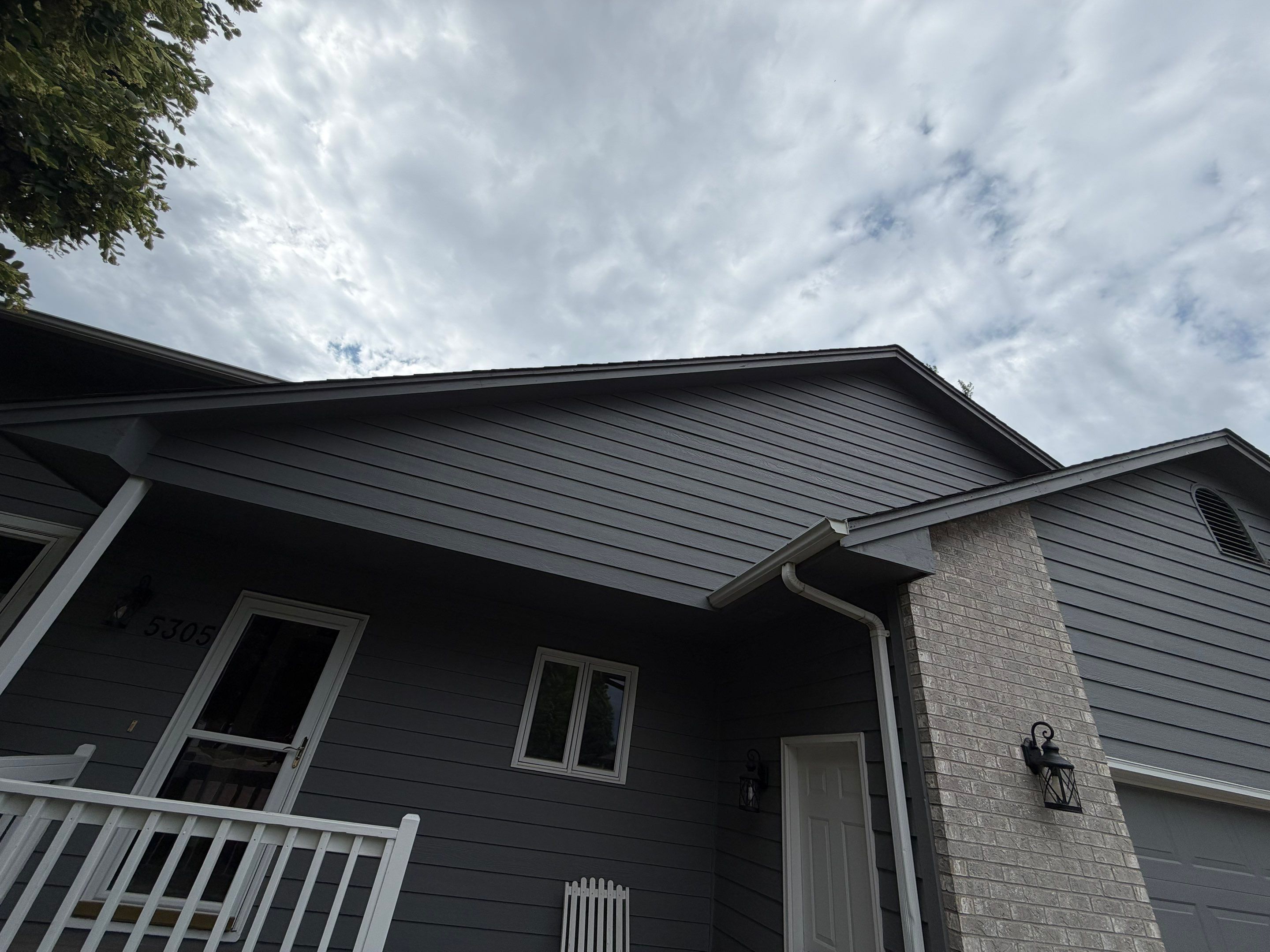 Full Exterior Painting for Gray Siding and Trim in Sioux Falls by Select Painting, Coatings & Garage Cabinets