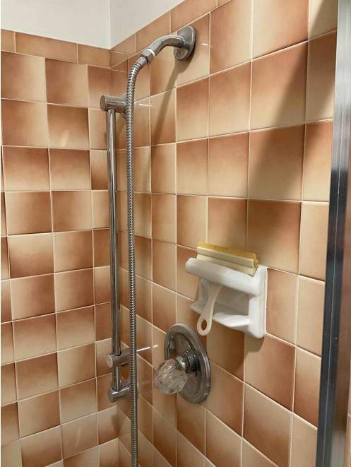 New shower, flooring, and countertop by The Shower Company
