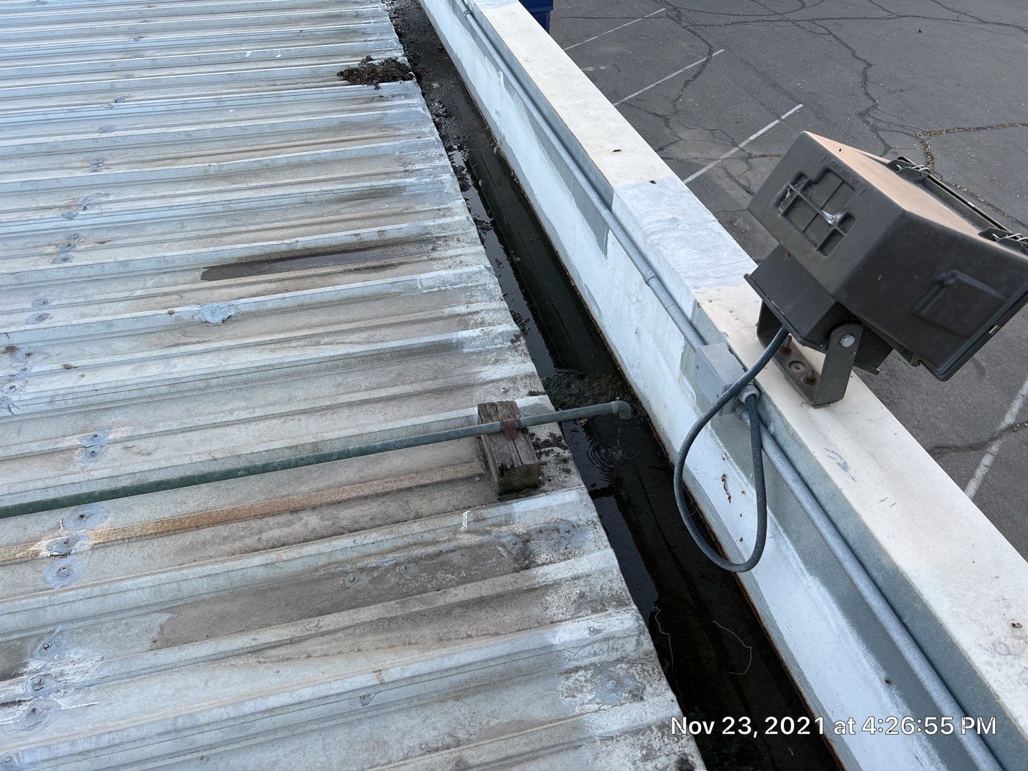 Metal roof restoration on commercial roof using Conklin Benchmark/ PUMA XL acrylic coatings over metal and foam by Straight Edge Roofing Inc