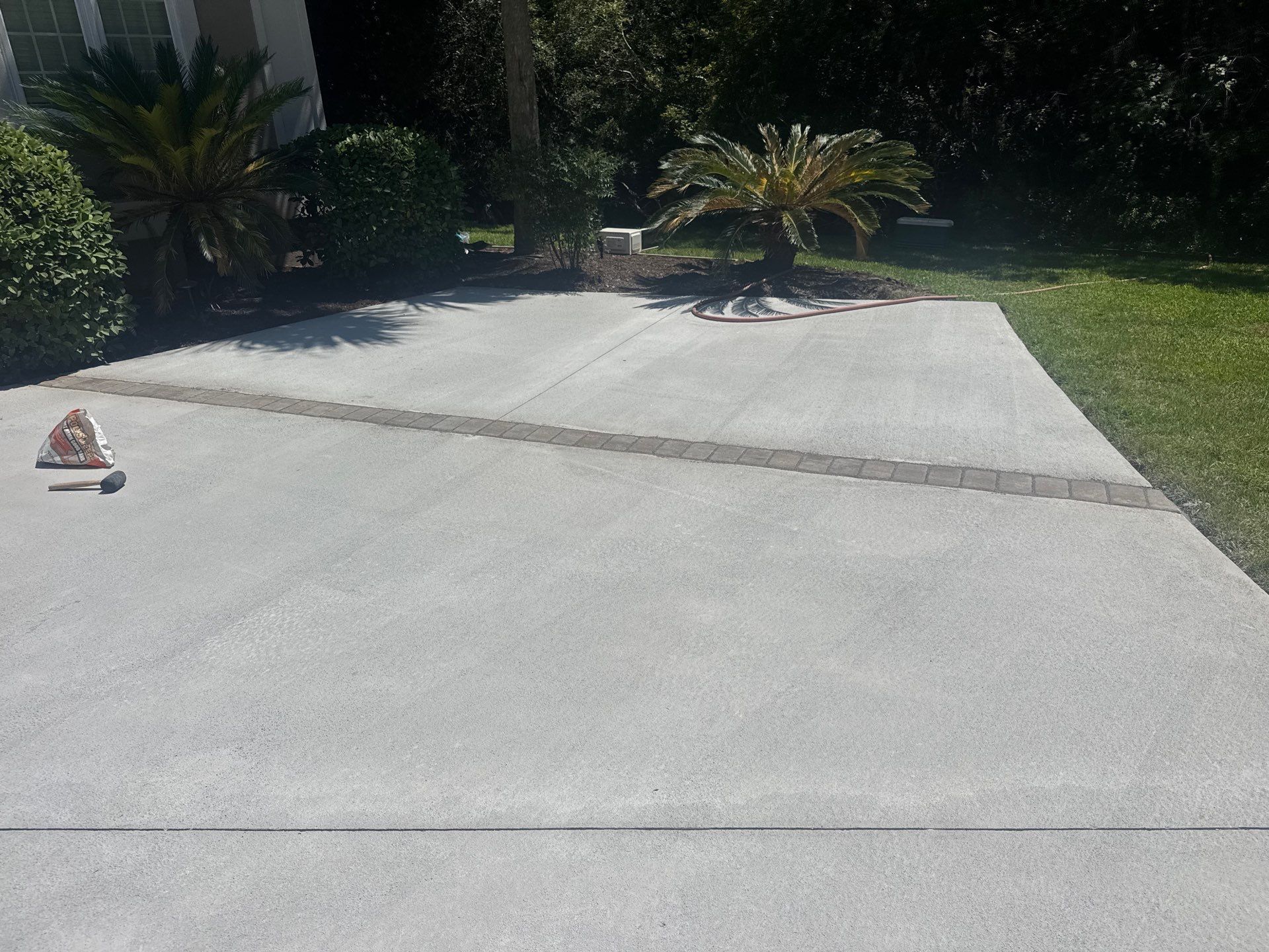 Custom Concrete Driveway and Decorative Paver Installation in Bluffton by Lowcountry Scapes, LLC