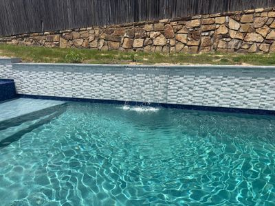 Geometric Pool with Raised Spa and Tile Spillway