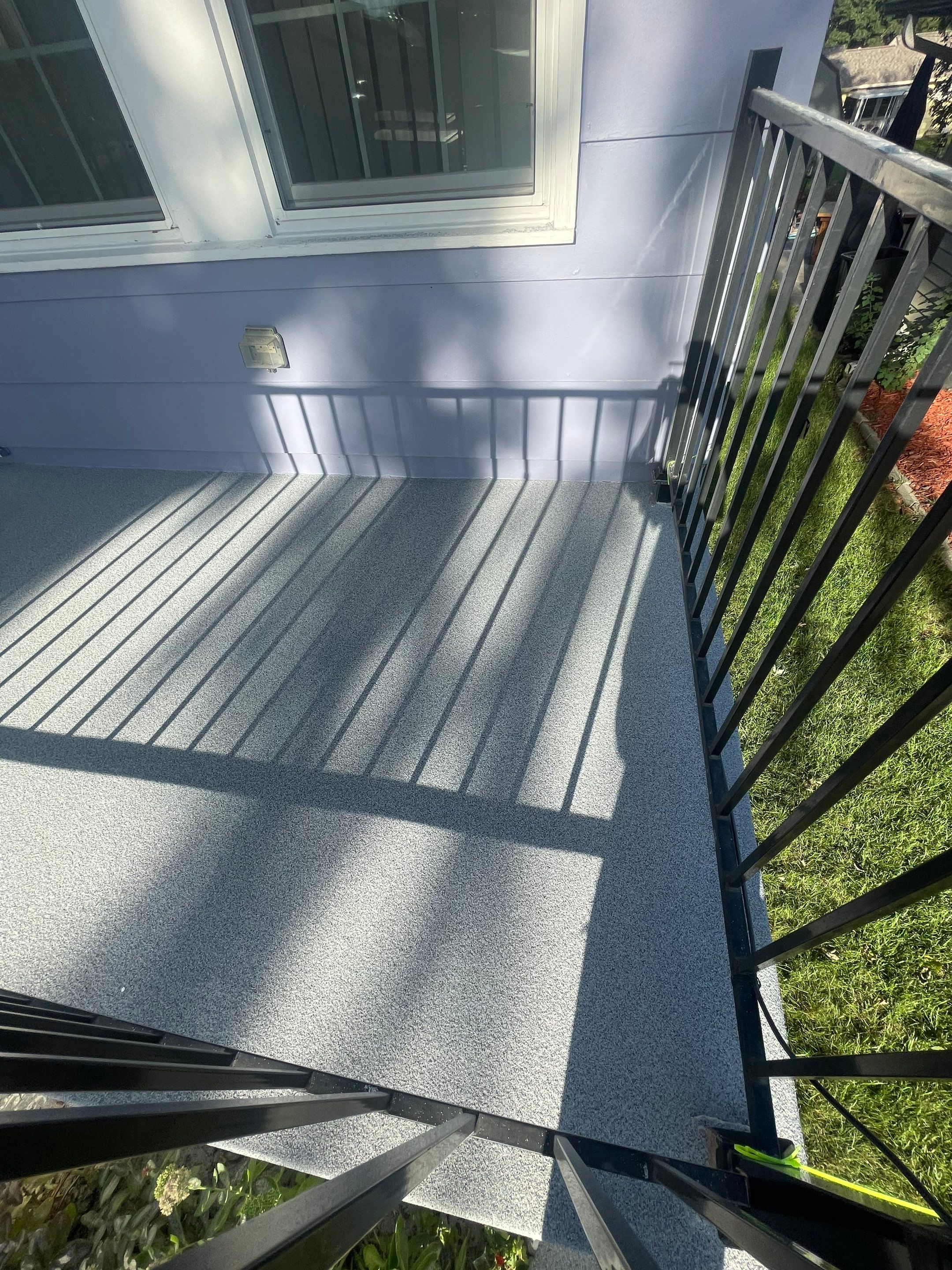 Sioux Falls Concrete Porch Coating with Starry Evening Finish by Select Painting, Coatings & Garage Cabinets