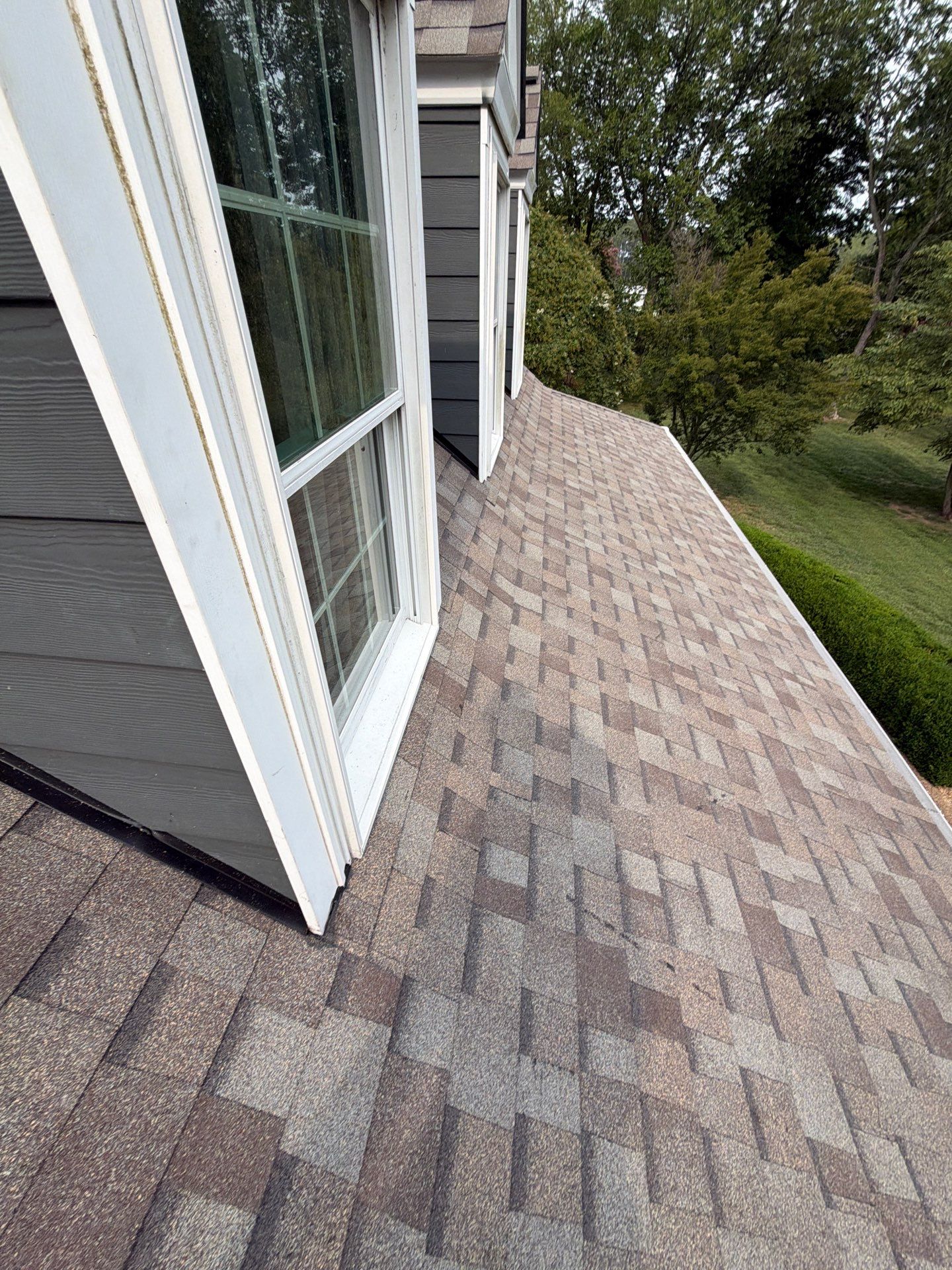Roof Replacement and White Gutter Installation in Gloucester by Cade Construction