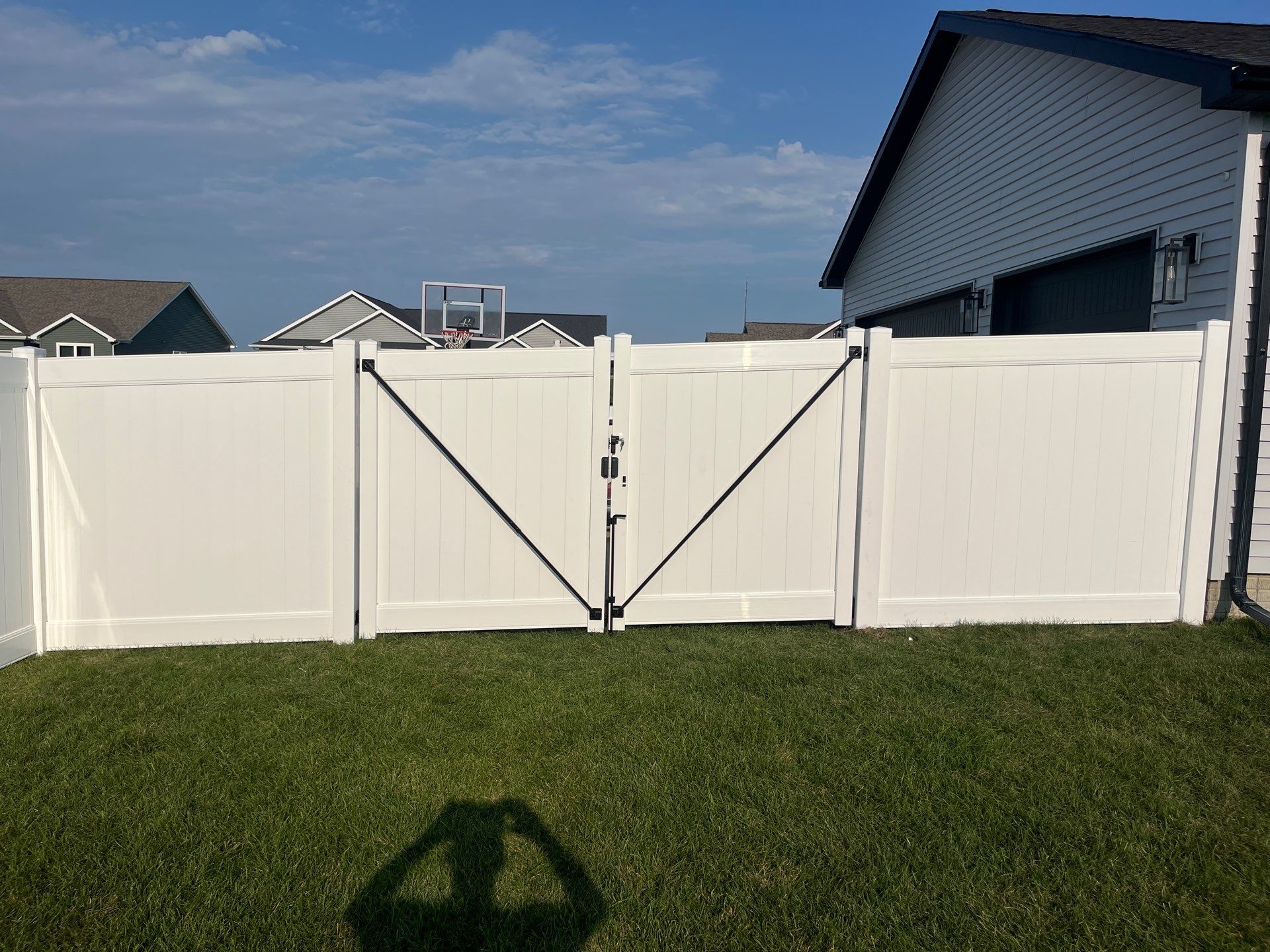 White Vinyl Privacy Fence Installation With Double Gates in Waterloo by Perfect Picket Fence and Stain