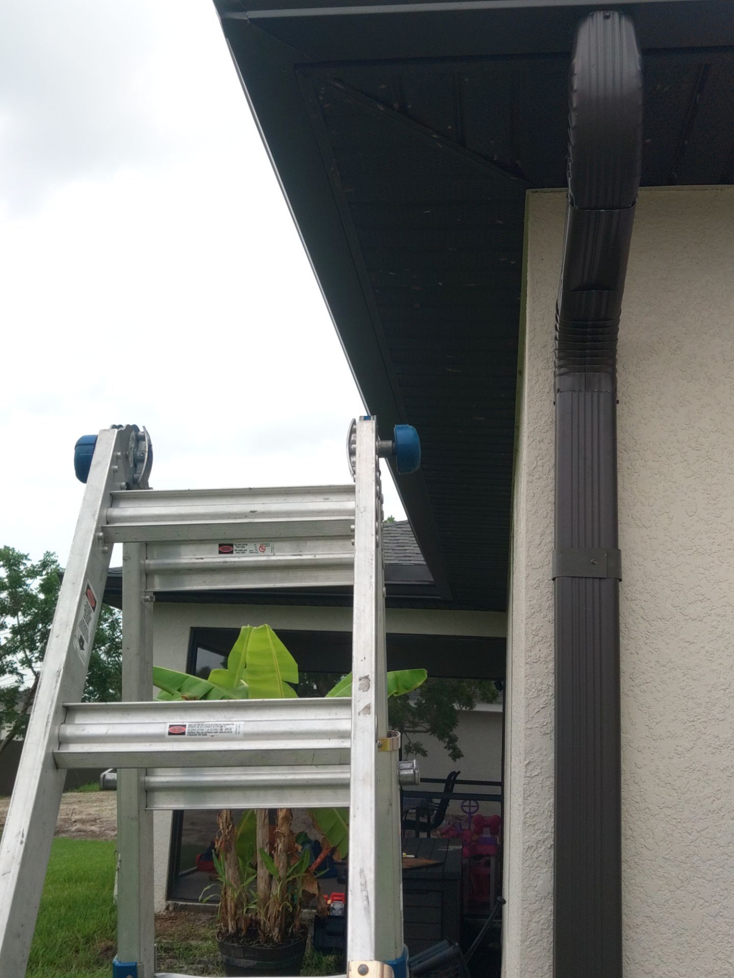 Black Seamless Gutters using black seamless gutters in Cape Coral FL by Gutter Professors