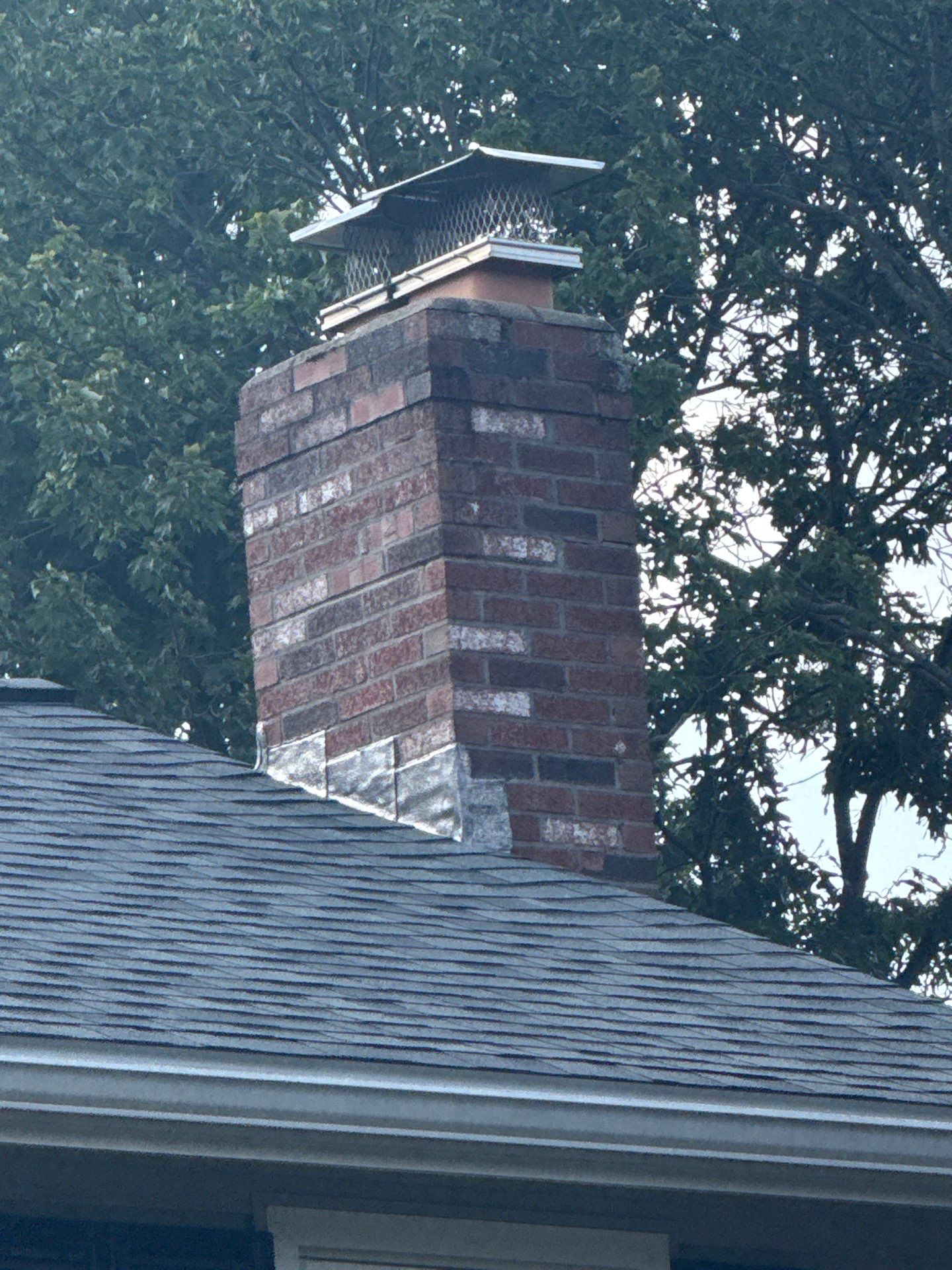 Complete Roof Replacement with Chimney Flashing, Gutter Guard System, and Vinyl Siding Repairs by Mighty Dog Roofing of Greater Middlesex County