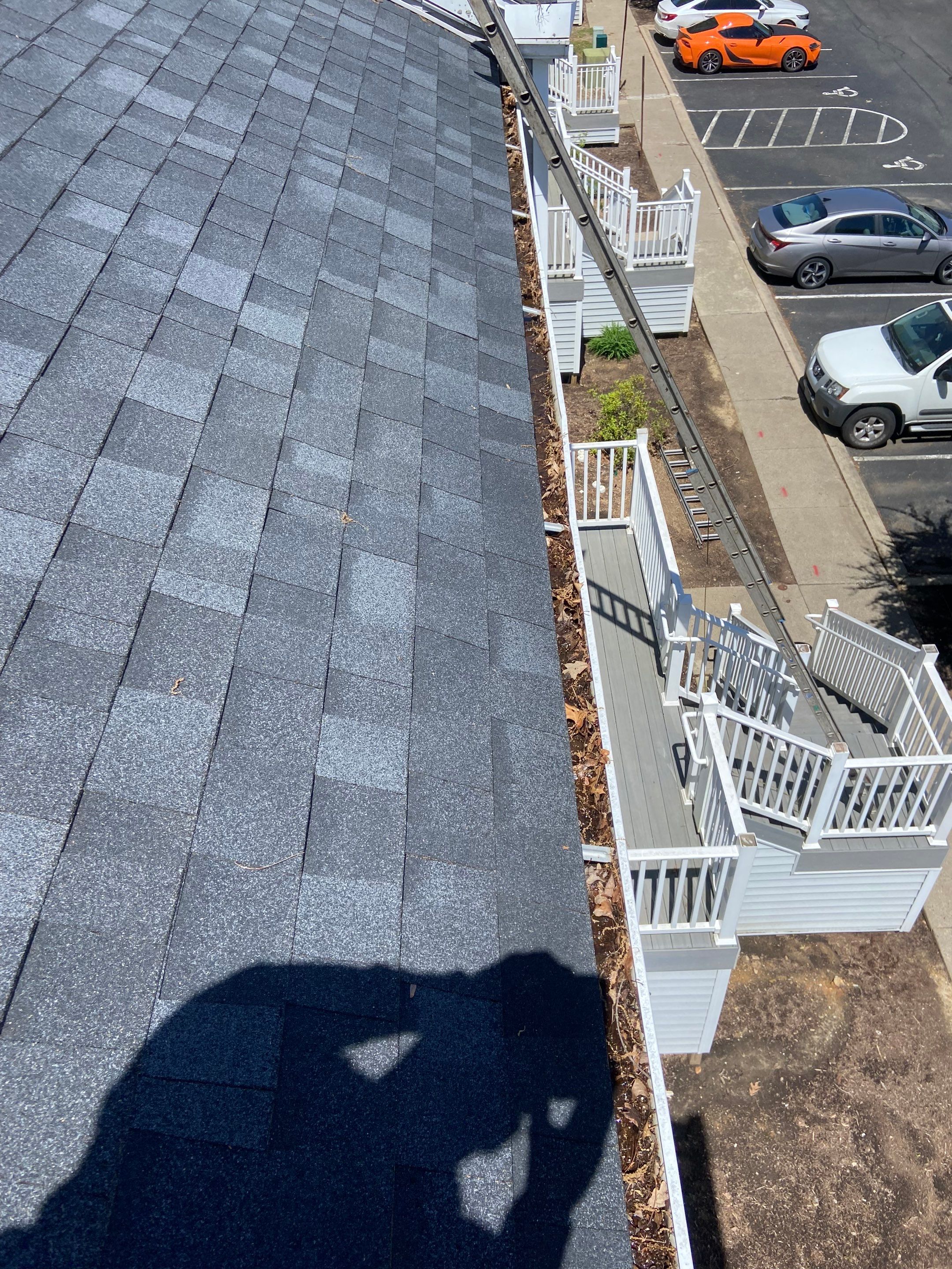 Commercial gutter cleaning State College, PA before photo with filled gutters