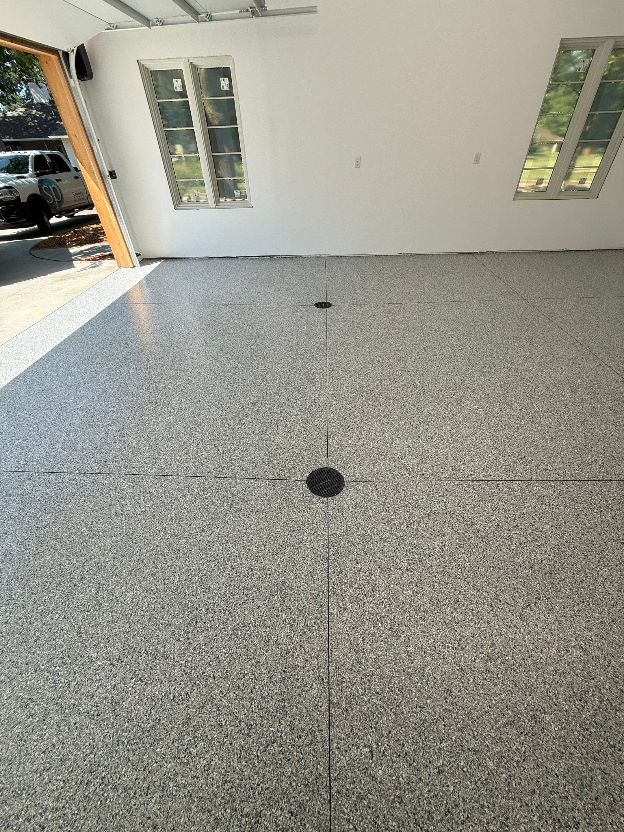 Multi-Car Garage Floor Coating Installation in Sioux Falls by Select Painting, Coatings & Garage Cabinets