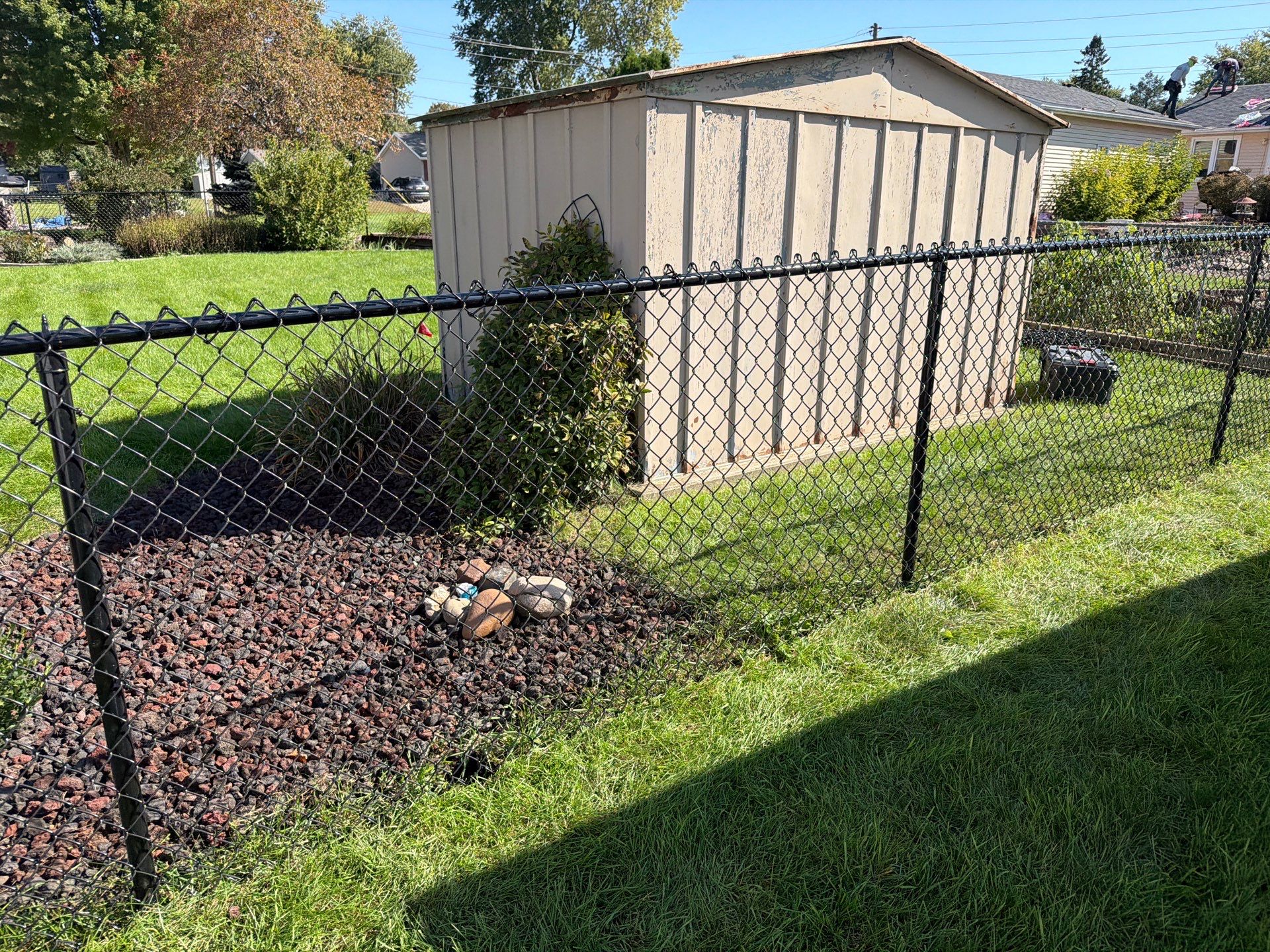 Custom Vinyl Privacy and Black Chain Link Fence Installation in Cedar Falls by Perfect Picket Fence and Stain