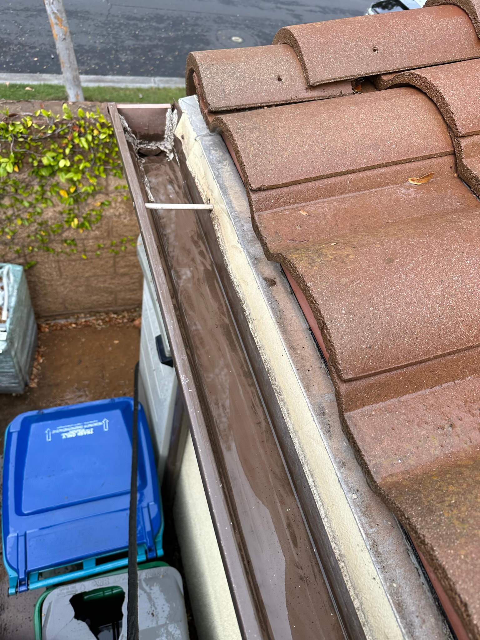 Clogged gutters at this Irvine home in Woodbury by Property Cleaning Experts, LLC