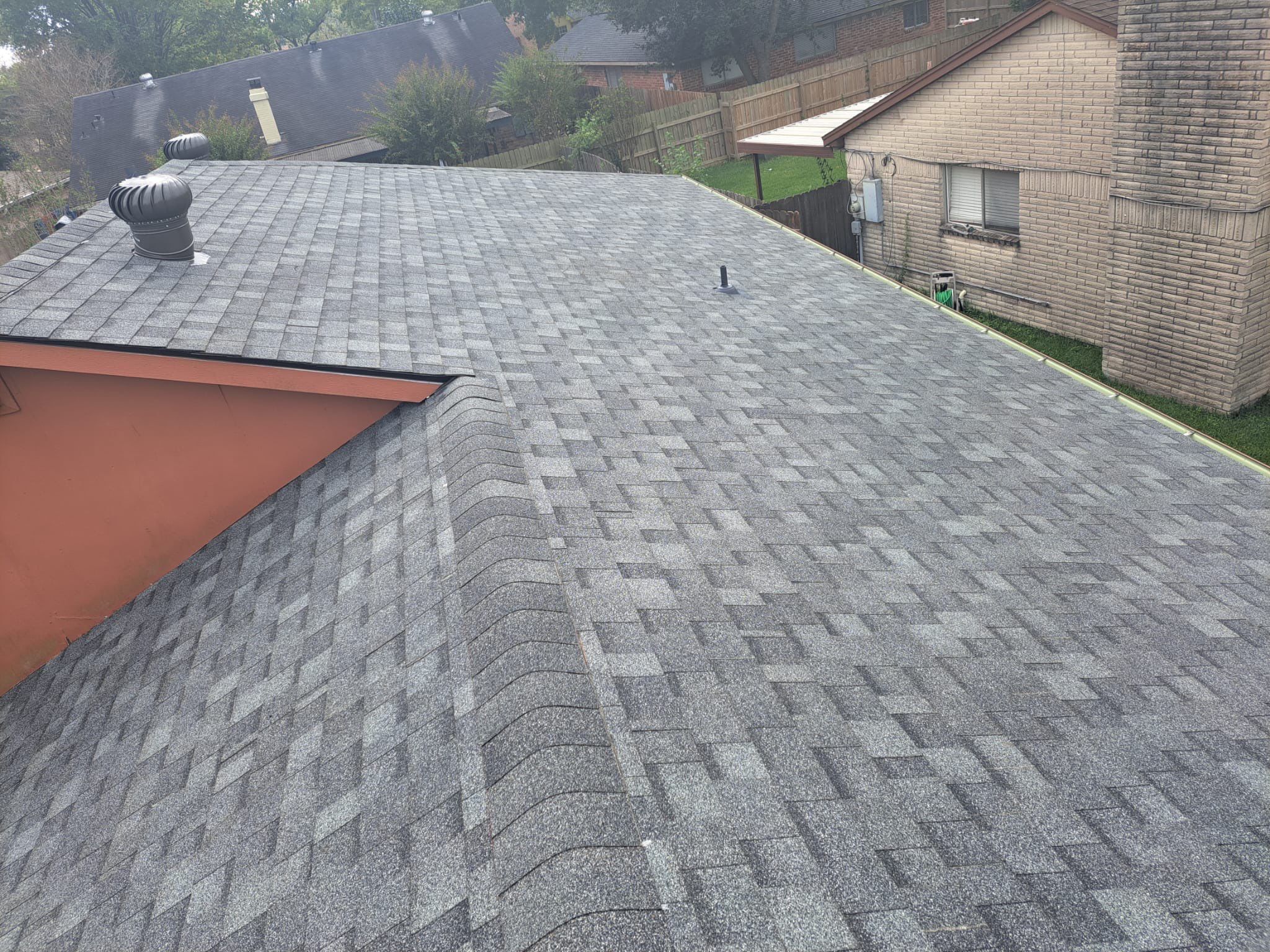 New Gray Shingle Roof on Brick Home — Houston, TX by PL Roofing & SB Roofing, LLC.