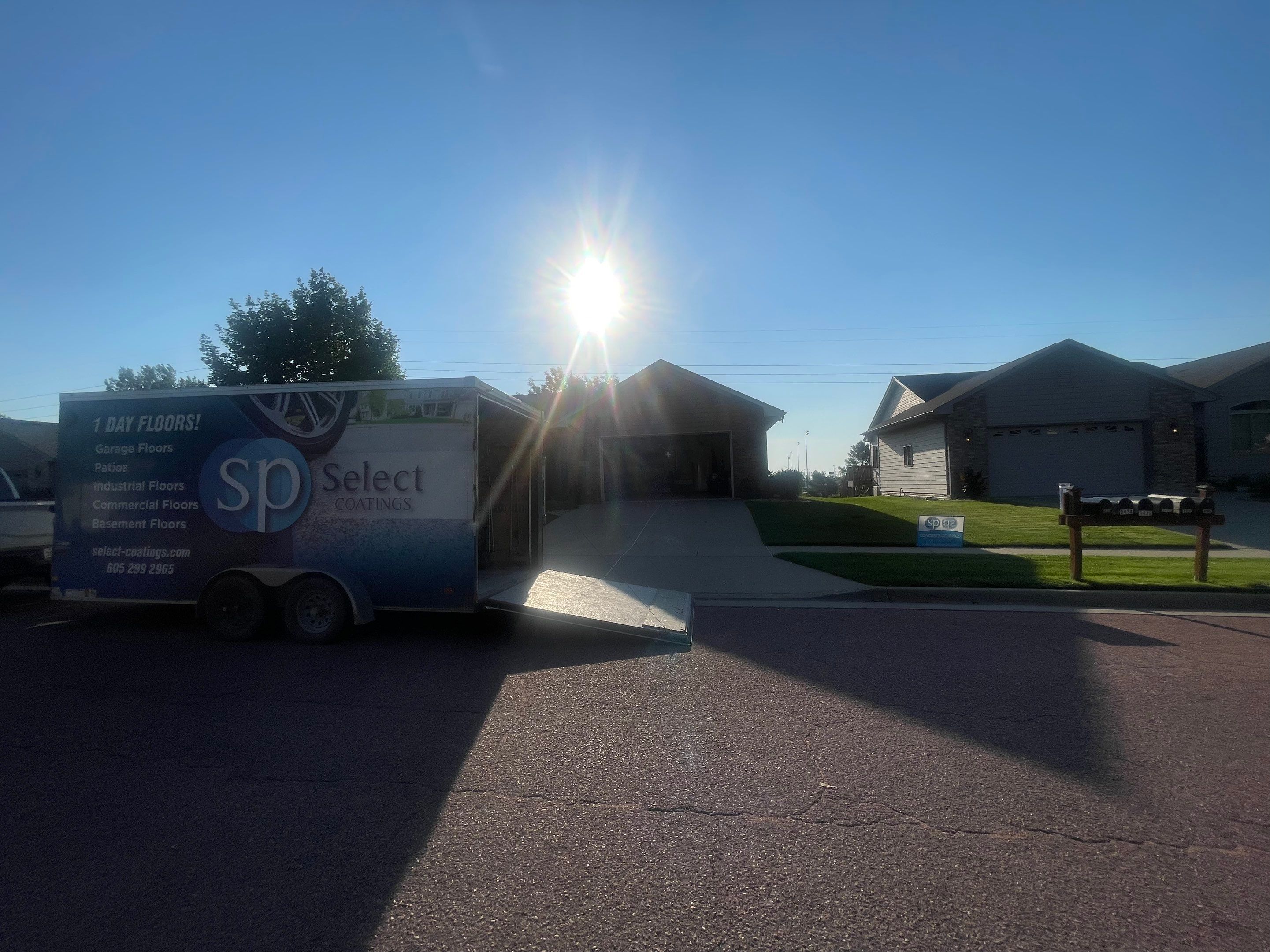 Custom Stamped Concrete Patio and Wood Pergola in Sioux Falls by Select Painting, Coatings & Garage Cabinets
