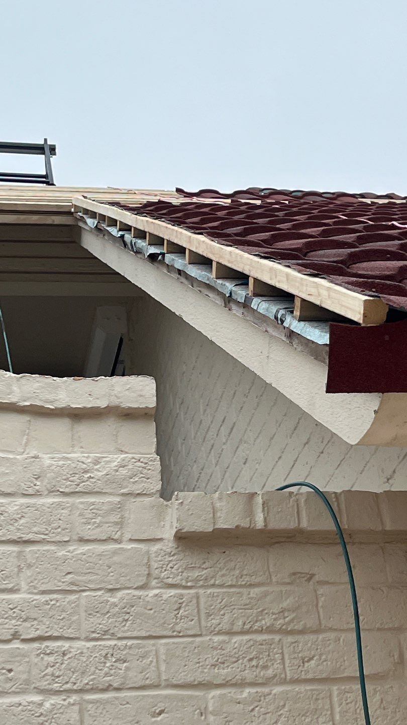 Off with the Tile and on with the TILCOR stone coated metal.  by Bayfront Roofing and Construction