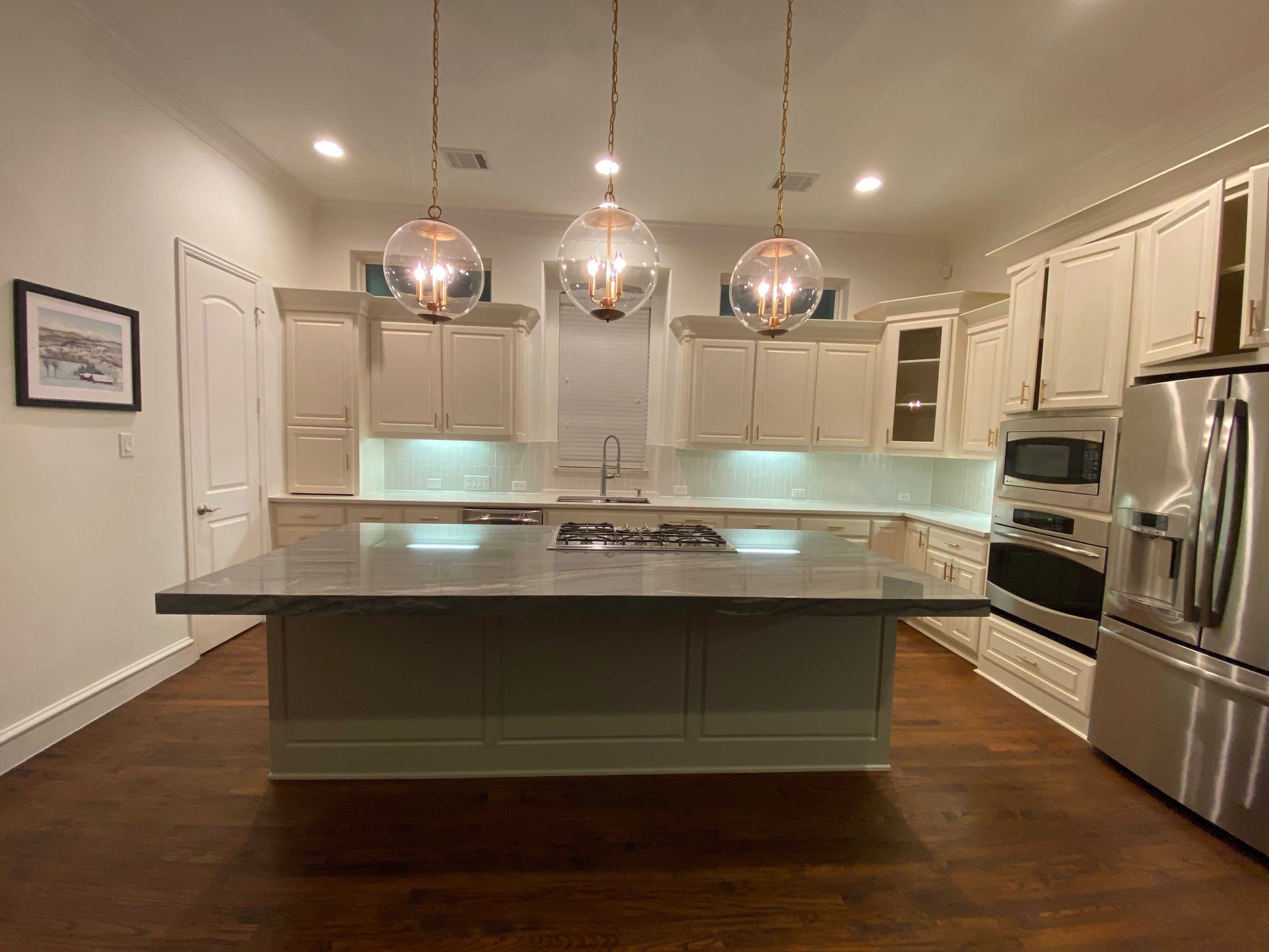 Kitchen Remodel using Quartzite by SLM General Contractors & Roofing