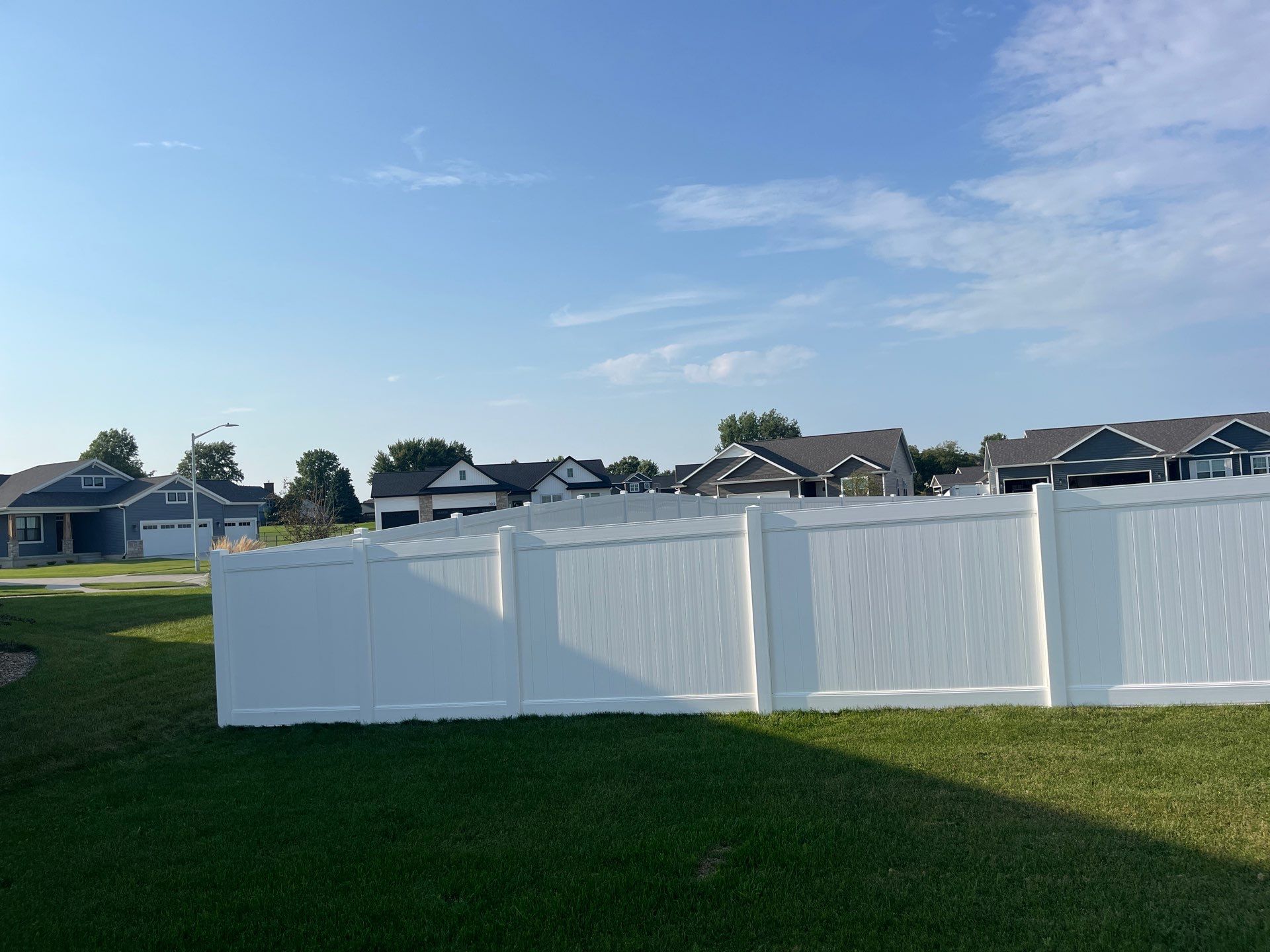 White Vinyl Privacy Fence Installation With Double Gates in Waterloo by Perfect Picket Fence and Stain