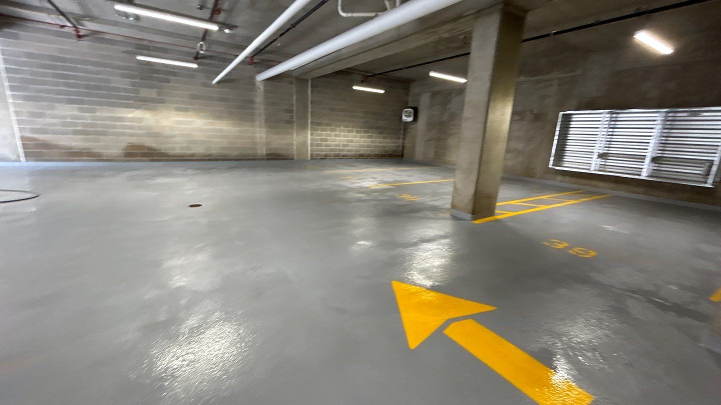 Parking garage using Hot water by Northern Power Washing LLC.