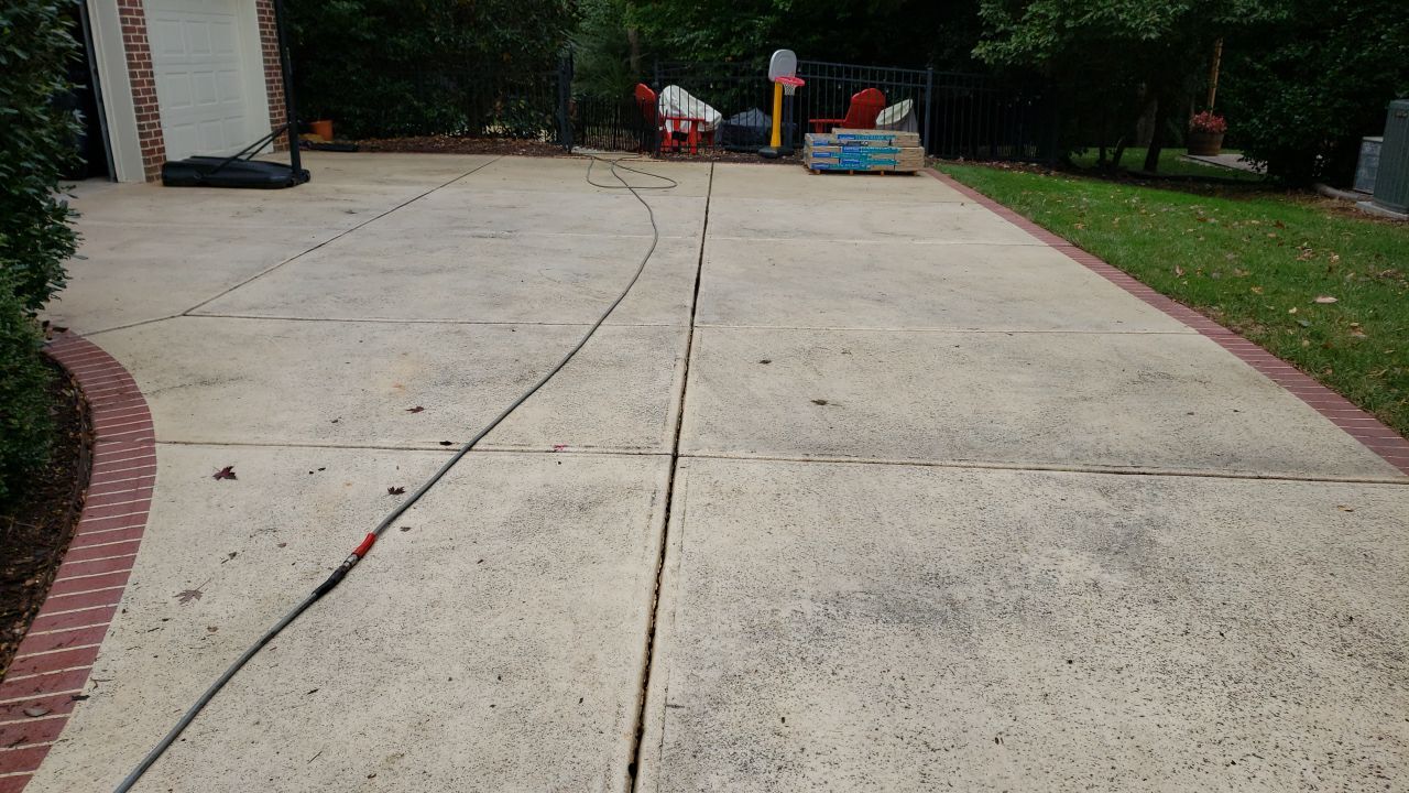 Driveway Clean using cleaner by Power Wash Masters LLC