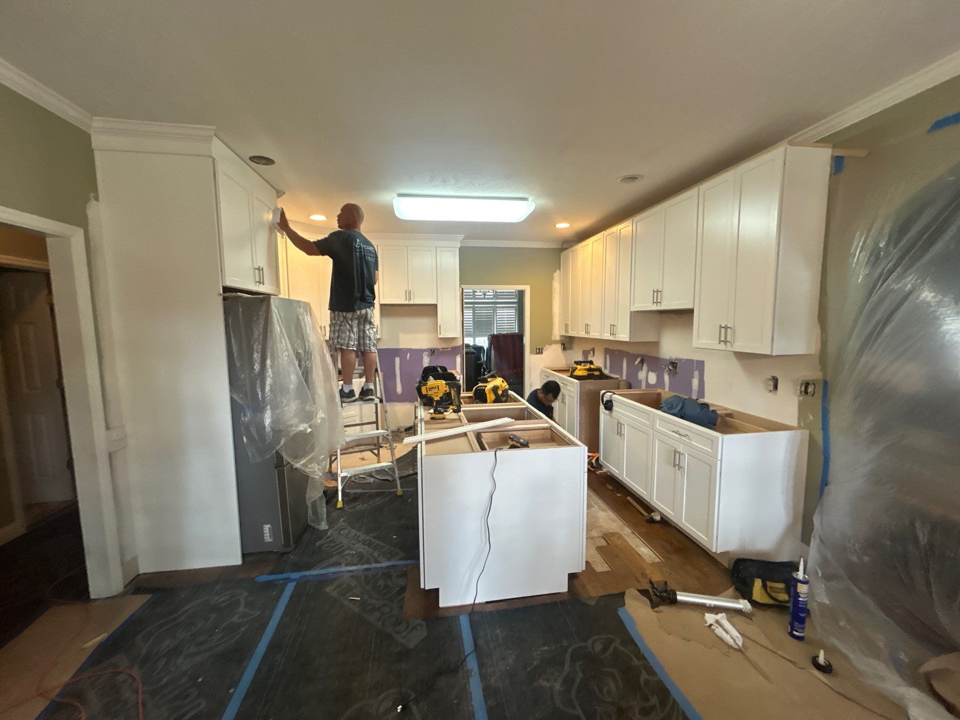 Complete Kitchen Renovation Featuring White Shaker Cabinetry in Fayetteville by Karcher Roofing & Construction