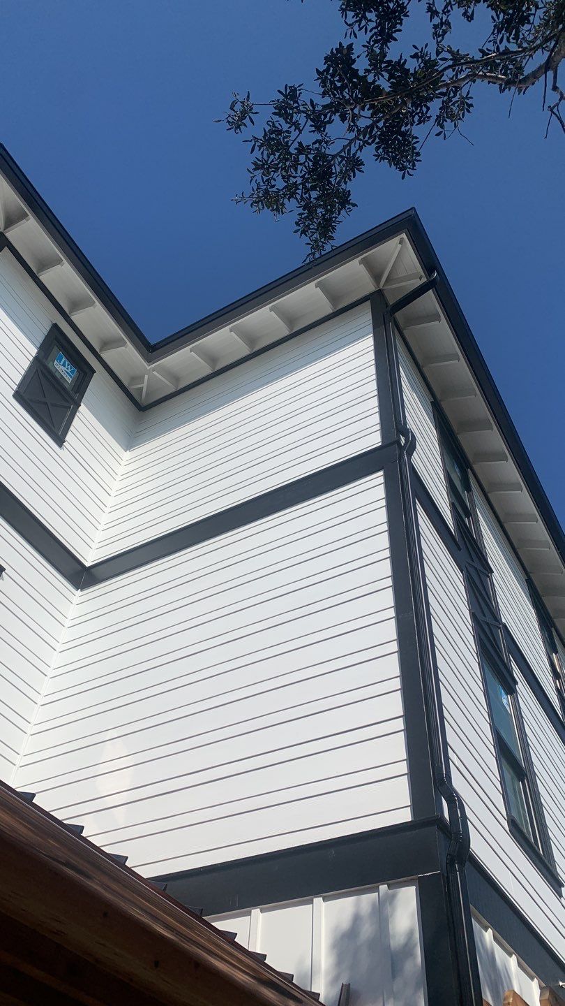 Seamless Gutter Installation Using Black Half Round Seamless Gutters by Gutter Professors