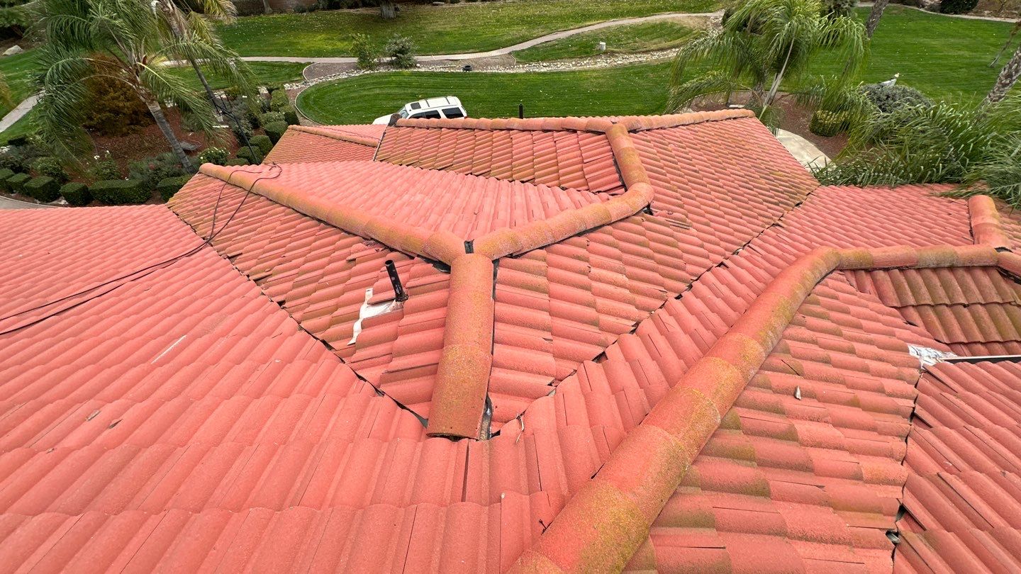 Tile refurbish project using existing tiles and replaced underlayment and battens by Straight Edge Roofing Inc