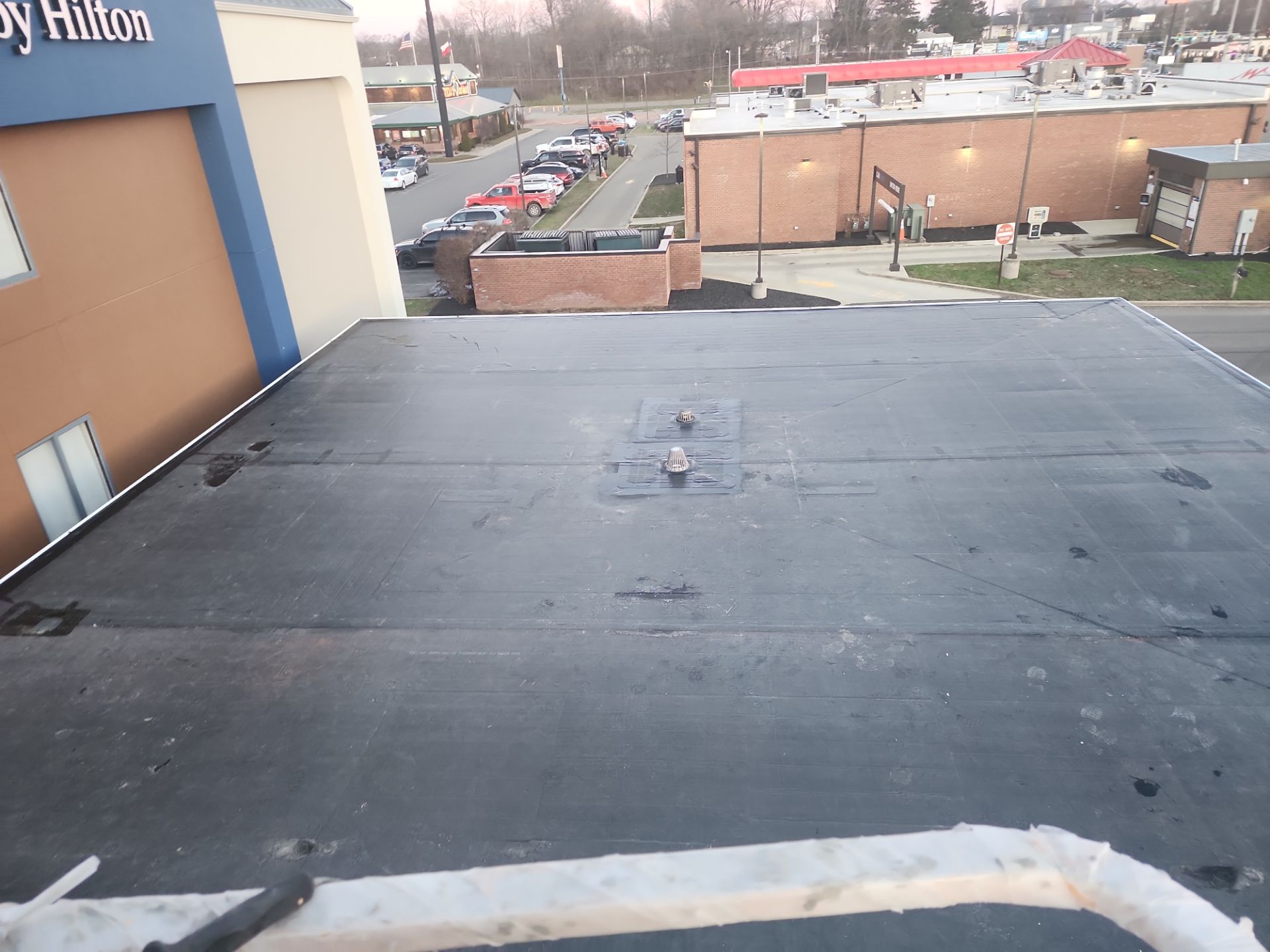 Commercial Roofing Installation using 60 mil rubber roof  by Nitro Roofing and Construction