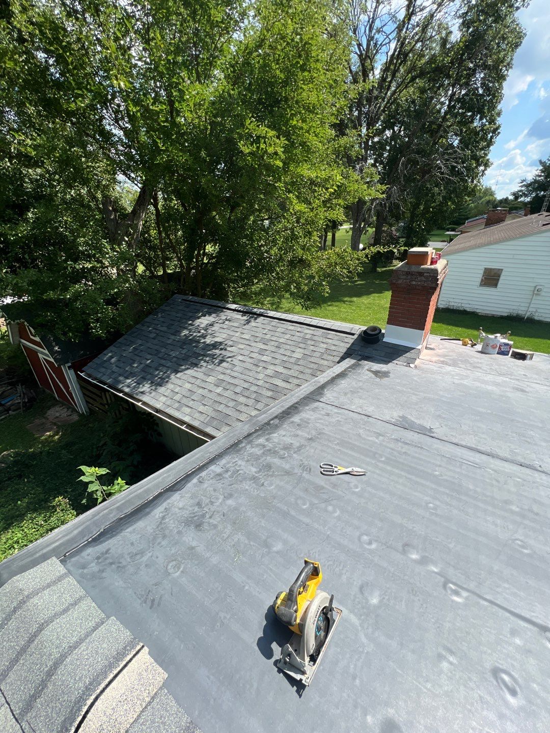 Residential Roofing Installation using 60 mil rubber roof  by Nitro Roofing and Construction