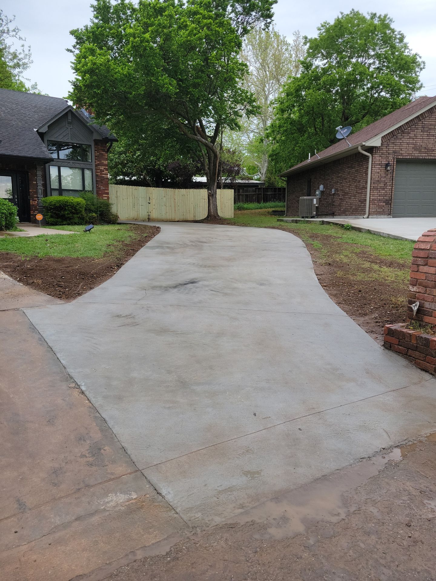 Concrete Driveway and Fence by Clays Services Inc